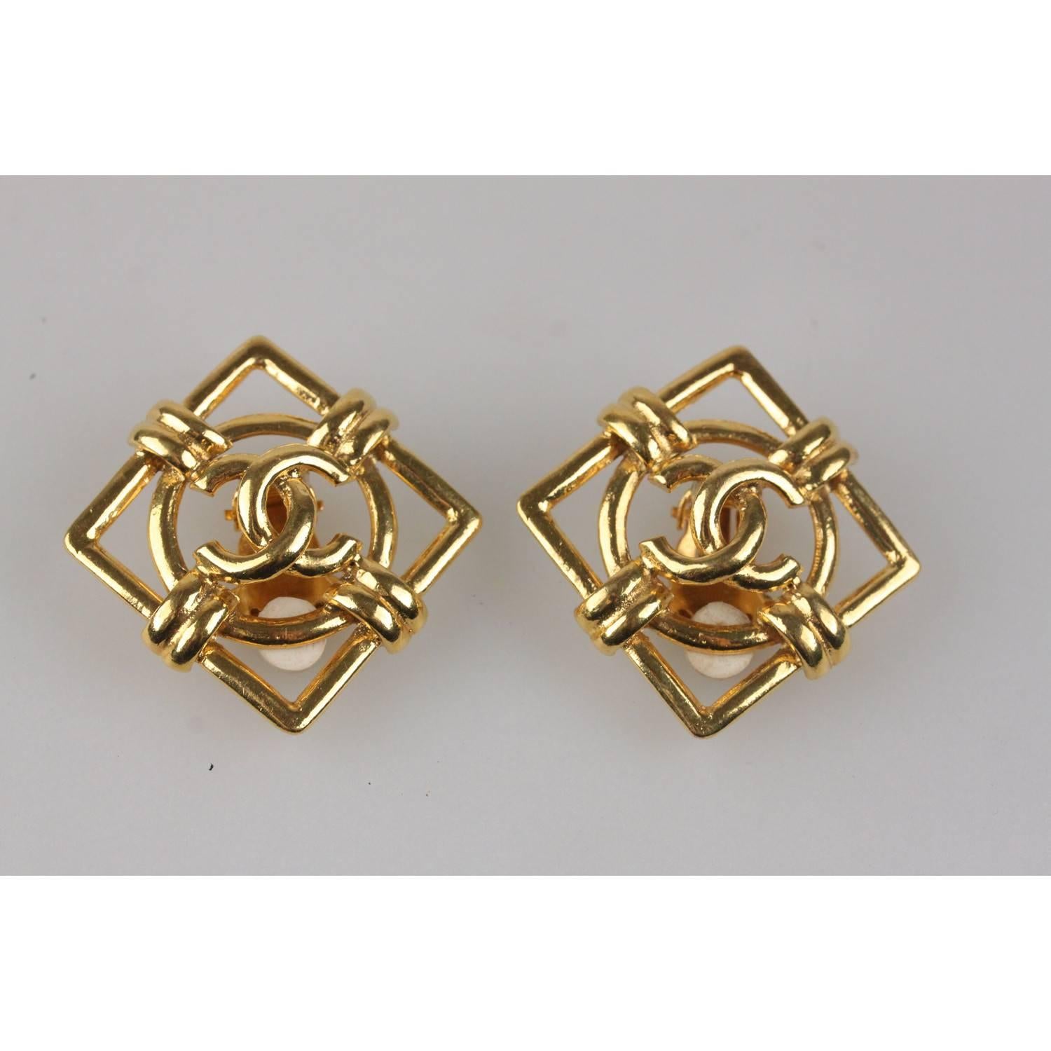 Vintage square clip on earrings in gold metal by CHANEL. 'CHANEL 2 - CC  - 9 -  Made in France' oval tag on the reverse of the earrings.