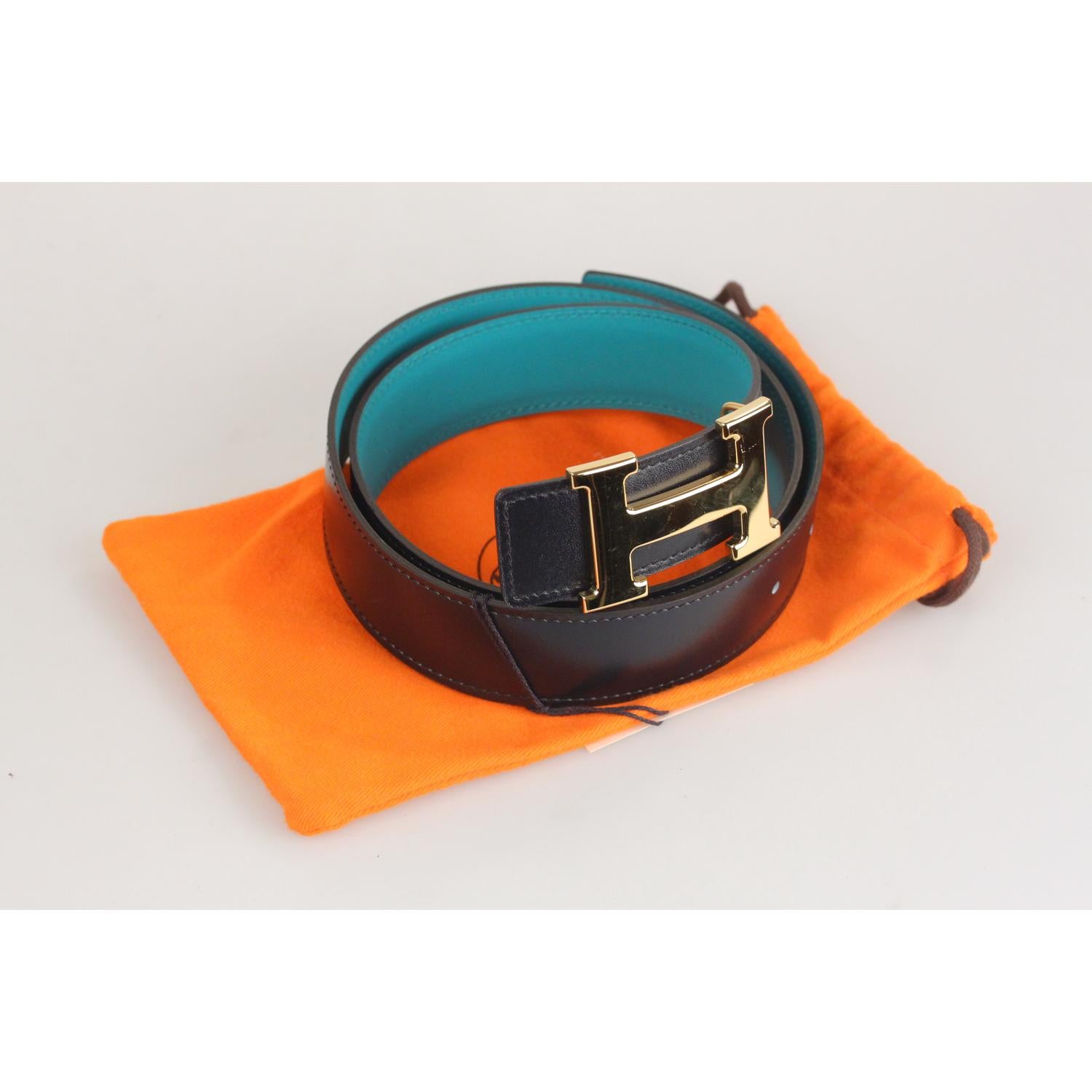 - Hermes Reversible Belt
- Blue leather on a side and teal leather on the other side
- Gold metal H Buckle
- 3 holes adjustment
- Size: 80 
- Logo & Tags: 'HERMES Paris - Made in France' engraved on the tan side, 'T' blind stamp without shape (Year