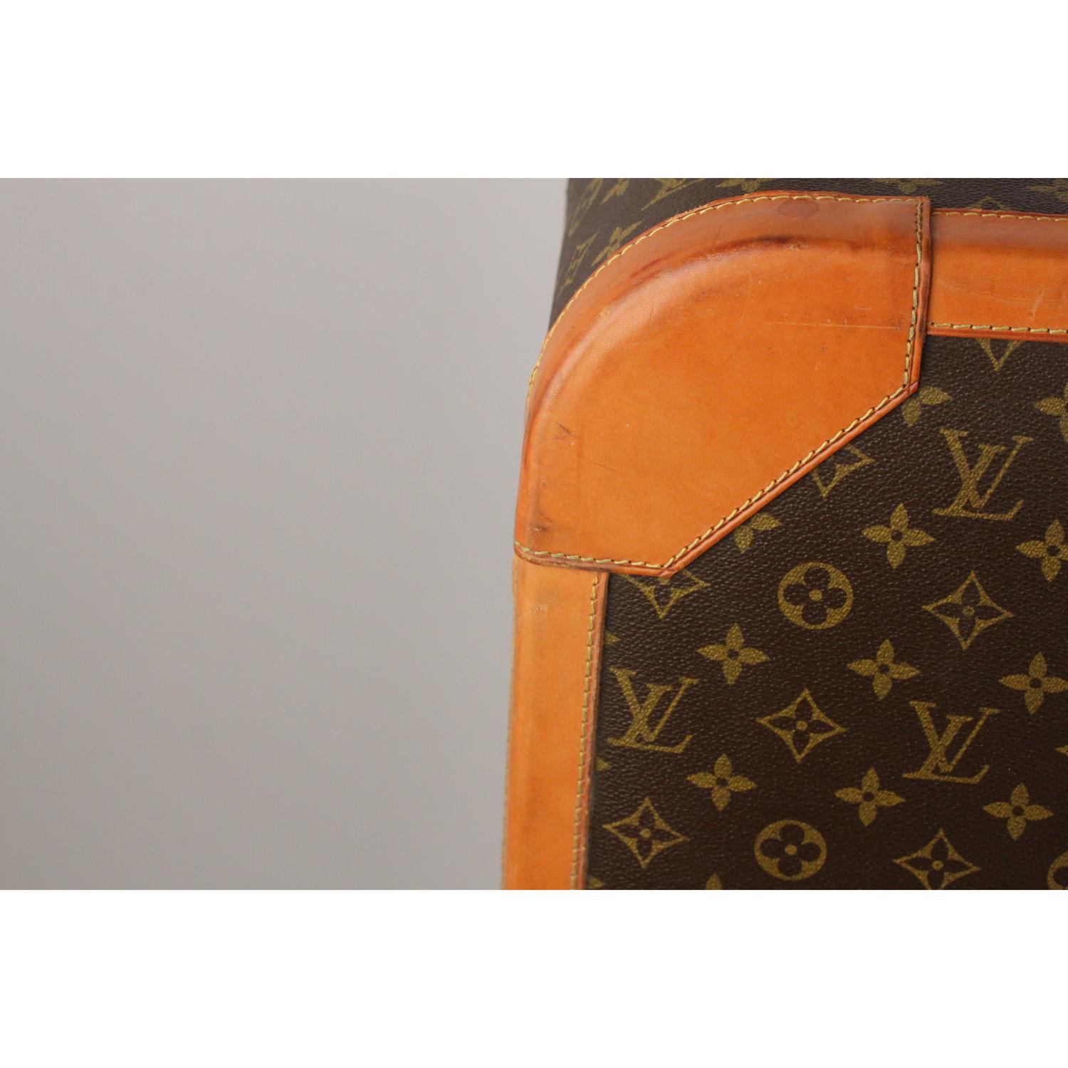- LOUIS VUITTON vintage Monogram Special Lock 80 Suitcase 
- A part of Louis Vuitton history, ideal for home or office decor 
- Monogram canvas 
- Canvas lining 
- Rounded leather handle with protective cover 
- Canvas interior
- Louis Vuitton