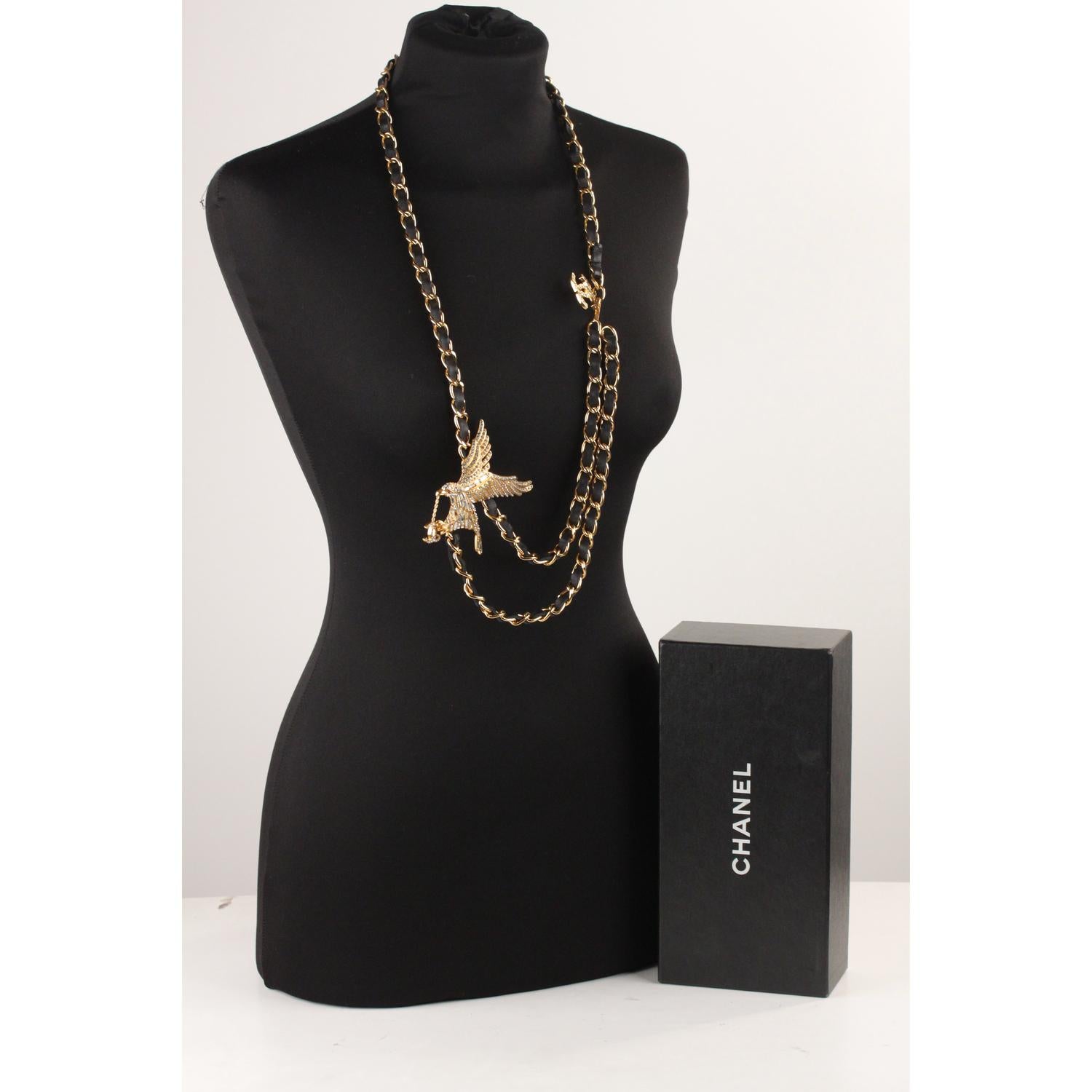 Rare CHANEL chain belt or necklace with beautiful rhinestone eagle, from the 2001 Spring  collection. It is very versatile and will complete every look (you can use it as a necklace or as a belt). Black leatehr interwoven chain with CC - chanel