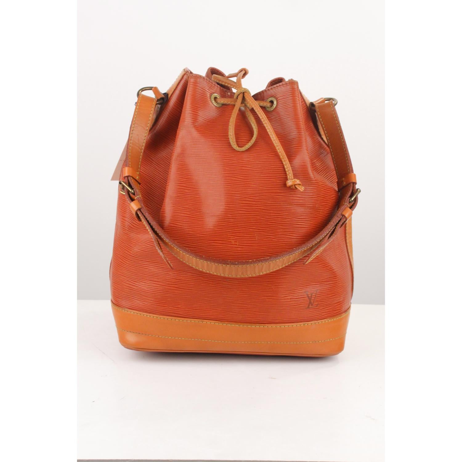 We offer Certificate of Authenticity provided by Entrupy for this item at no further cost.

Iconic NOE' by LOUIS VUITTON was first created in 1932 to carry champagne bottles. Tan Epi Leather with smooth leather trim, with drawstring closure and