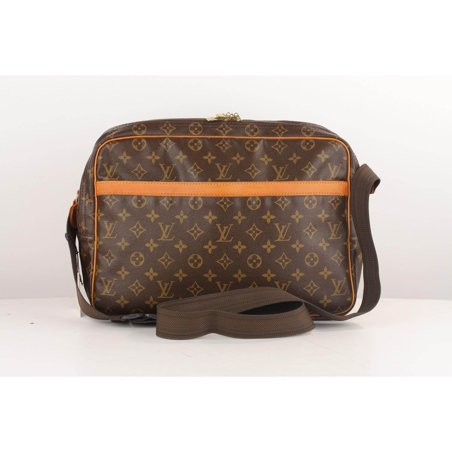 LOUIS VUITTON 'Reporter GM'  carfted in timeless monogram canvas with vachetta leather trim. It features 1 large open pocket on the front. Golden brass hardware and adjstable canvas shoulder strap. 2 main compartments with zip closure. Inside it has