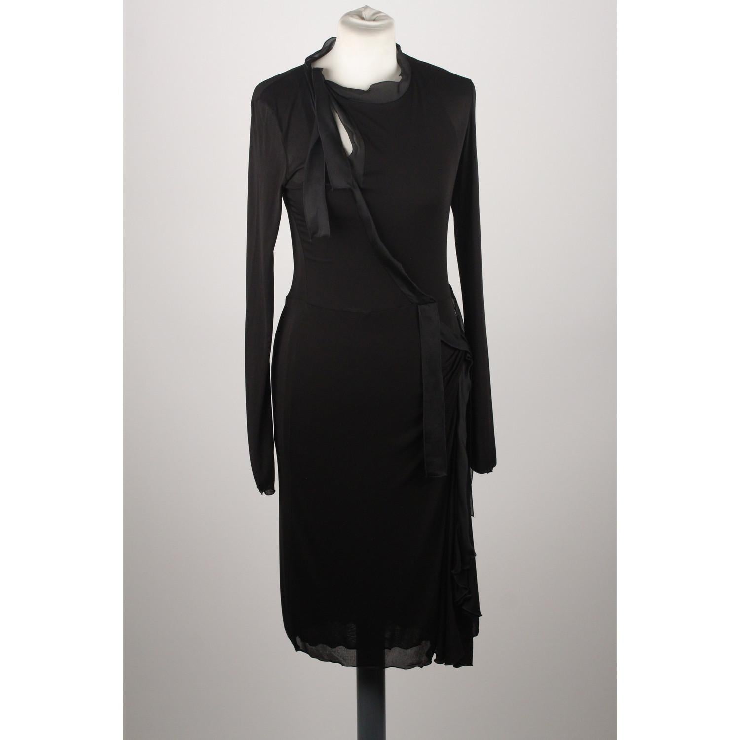 - Yves Saint Laurent Rive Gauche - Made in France  
- Black color 
- Composition: 100% Viscose
- Long sleeve styling
-  Wrap design 
- Side zip closure
- Size :  SMALL (The size shown for this item is the size indicated by the designer on the label).
