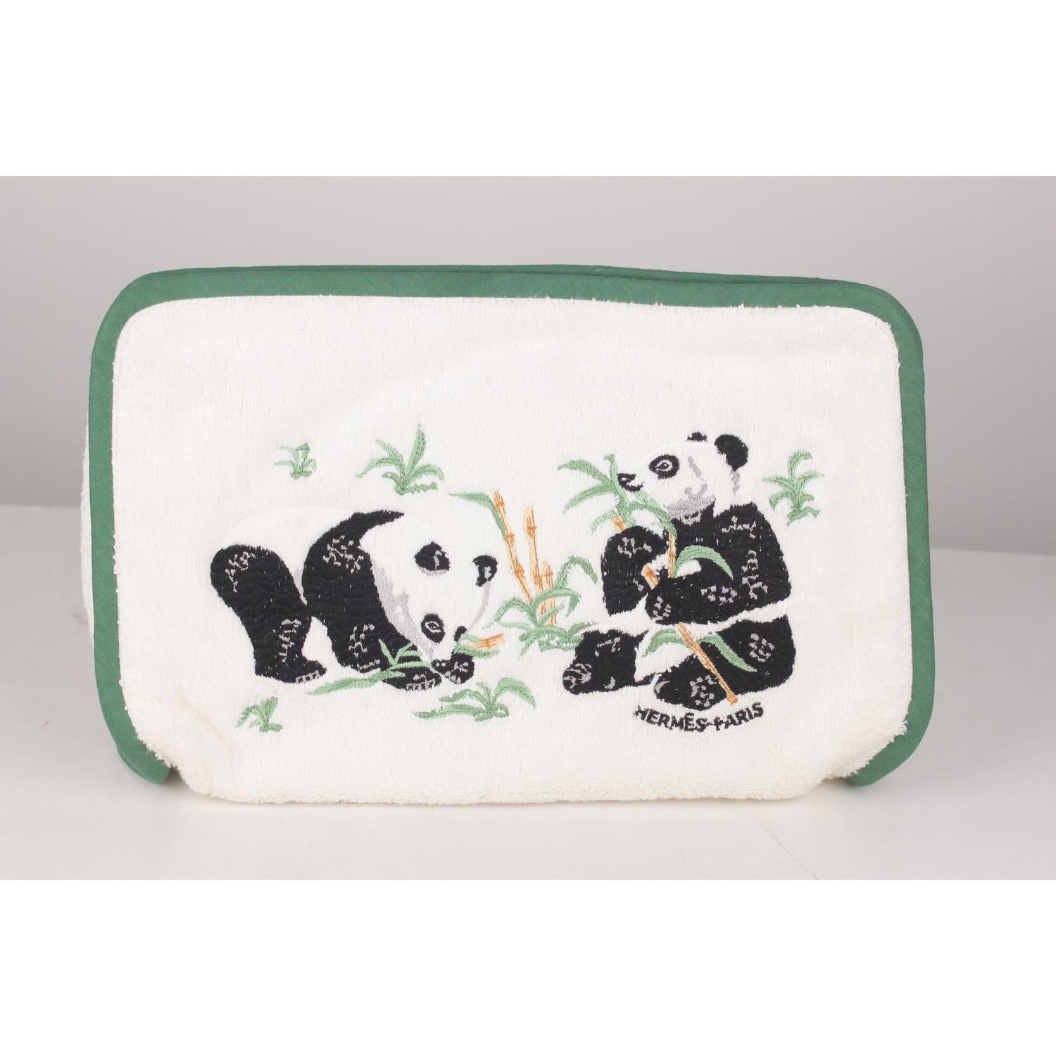 - Hermès cosmetic bag crafted in white quilted terry cloth 
- Embroidered panda design on the front 
- Piped green edges 
- Upper zipper closure 
- Cotton lined interior 
- This piece is in excellent condition. No stains, smells, or fabric pulls.