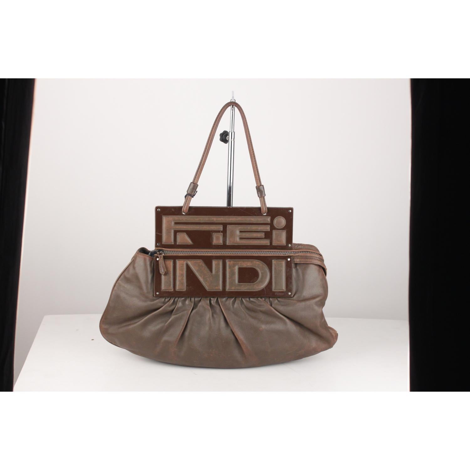 - Fendi Brown Leather 'To You Convertible Clutch Bag' 
- Gorgeous draped leather in brown color
- Resin panels with a fold over flap (can be carried by the handle or folded over for a clutch look)
- Top carry handle
- Zip top closure
- Brown fabric