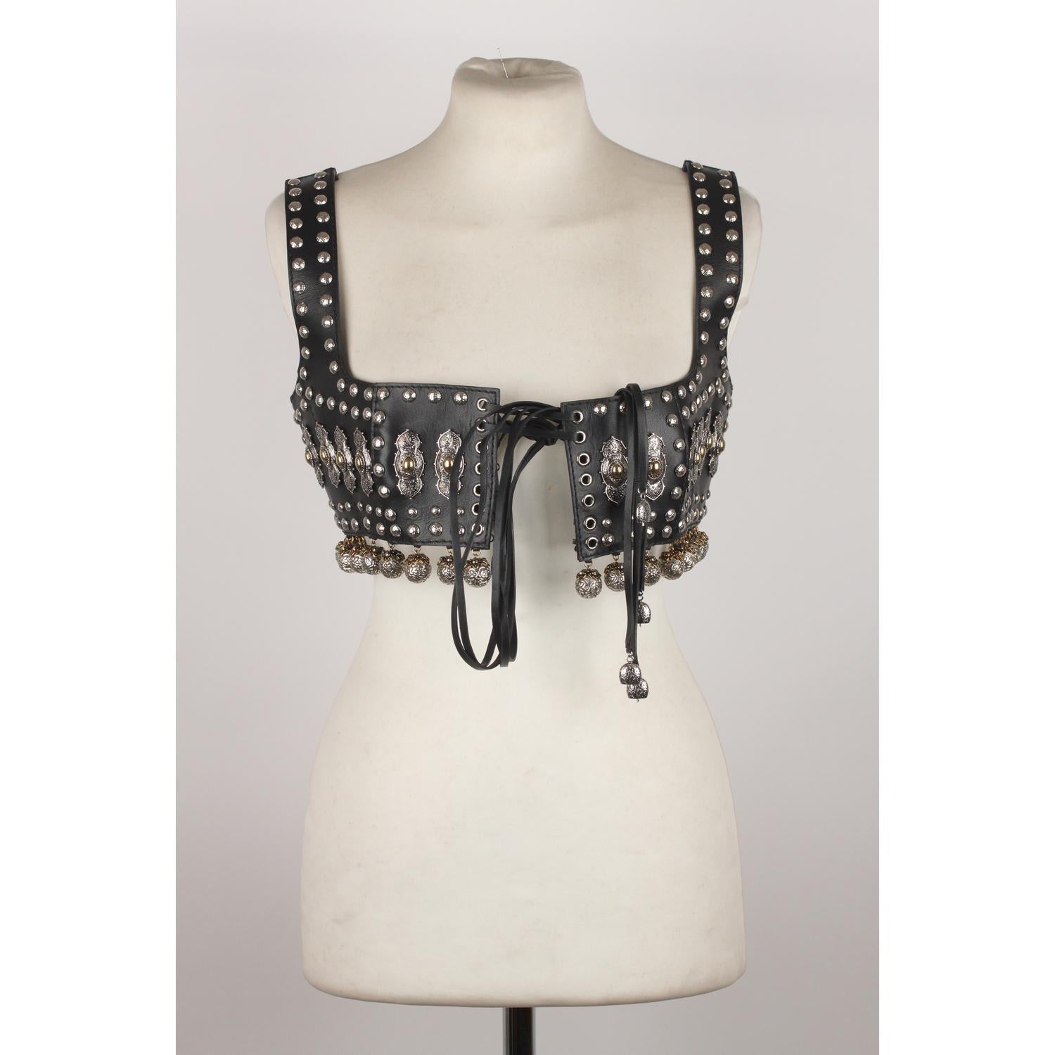 Alexander McQueen Black Leather bustier top from the 2017 Spring Collection. The top is embellished with a mix of jewelled and hammered studs. Leather lacing on front with an internal hook and eye closure. 94% Calf-skin leather, 6% Brass.