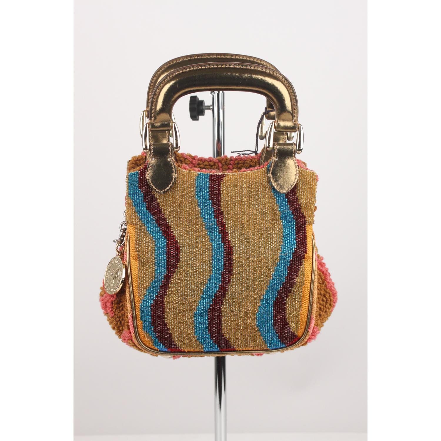 - Fendi multicolor 'Biancaneve Bag' with beaded dornt and knitted sides 
- Double top handle covered with gold metal leather
- Snap closure on top
- Silver metal chain strap (detachable)
- Gold metal FENDI 1925 anniversary medallion attached to the