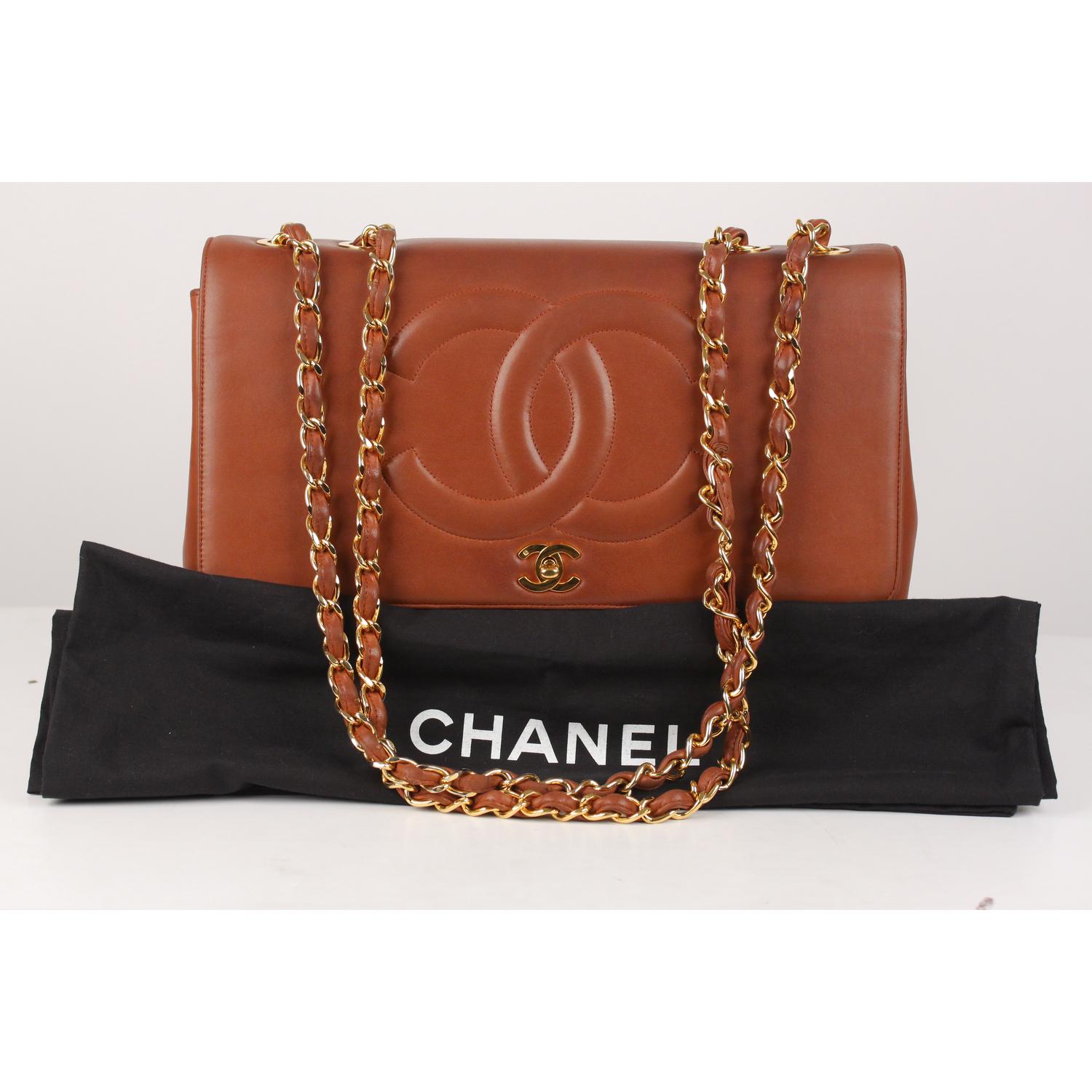 We offer Certificate of Authenticity provided by Entrupy for this item at no further cost.

CHANEL Lambskin Jumbo CC Logo Shoulder Bag in brown color. Single flap design, crafted of brown diamond quilted soft lambskin leather. The bag features gold