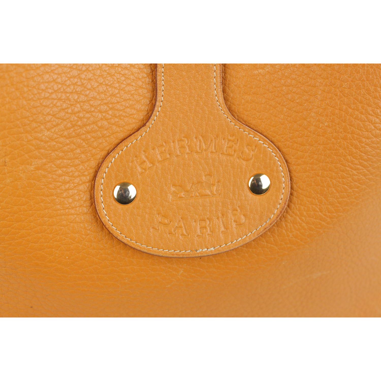 Vintage rare Hermes 'Rodeo' crossbody  ba, crafted from a textured tan leather and featuring an adjustable  shoulder strap, an open top with a fold over strap with snap button closure. 'HERMES PARIS' logo patch on the back. Suede interior. 'Hermes
