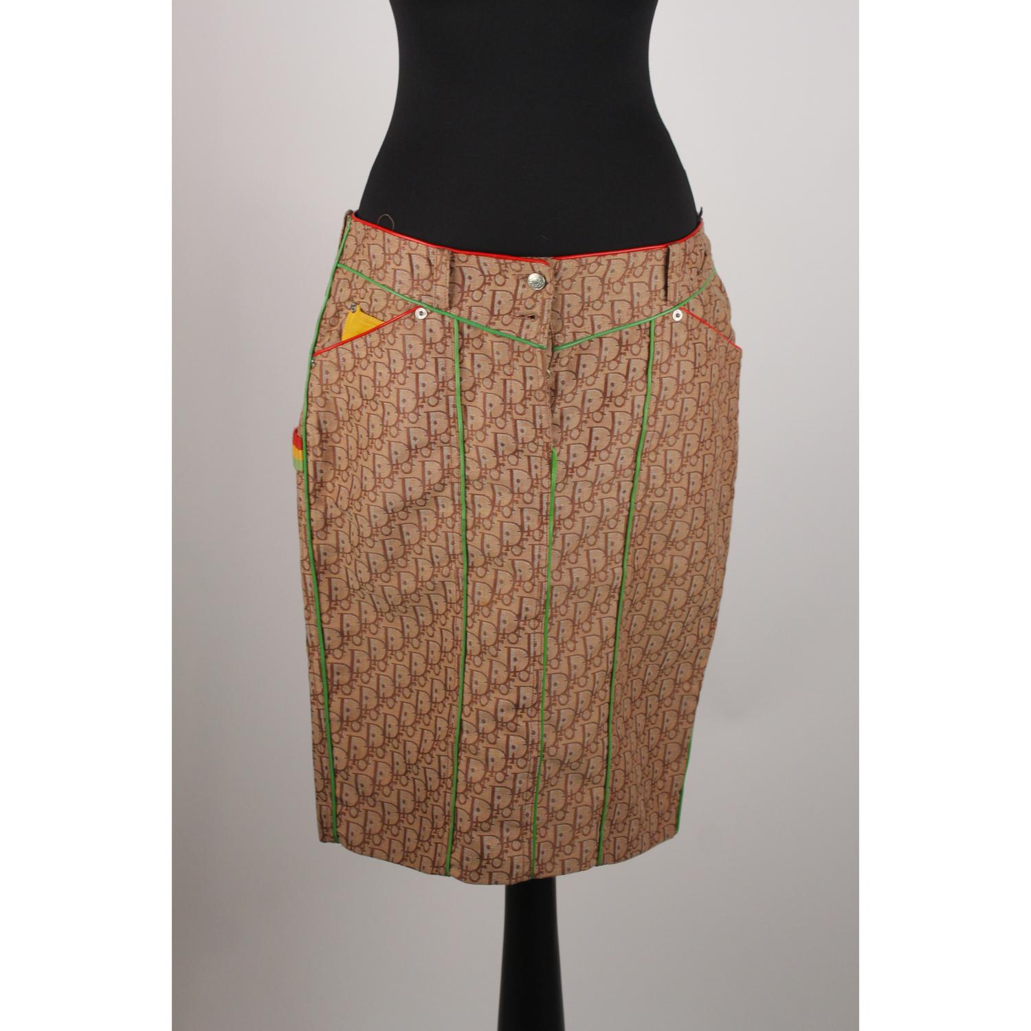 - CHRISTIAN DIOR 'Rasta' Skirt design by John Galliano 
- Period/Era: 2004
- Beige Dior monogram jacquard
- Red and green leather trim 
- Belt loop details 
- 2 yellow patch pockets on the back
- Rear Vent
- Made in Portugal
- Composition: 66%