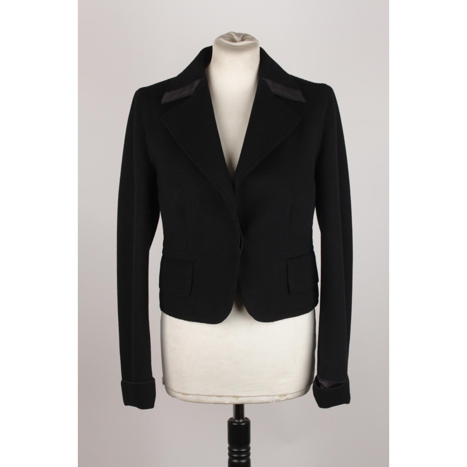 Single breasted baize blazer by GUCCI in black color. Unlined. Single button closure. Stain lining and inner pockets. Size 42 IT (The size shown for this item is the size indicated by the designer on the label)