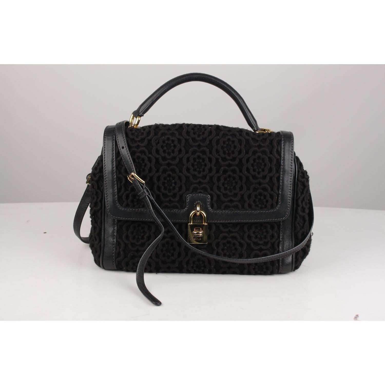 Dolce & Gabbana 'Miss Bonita' Satchel in black crochet and tweed fabric with genuine leather trim, handle and choulder strap. It features a chain-link and leather handle, removable shoulder strap, flap with decorative padlock with twistclosure and