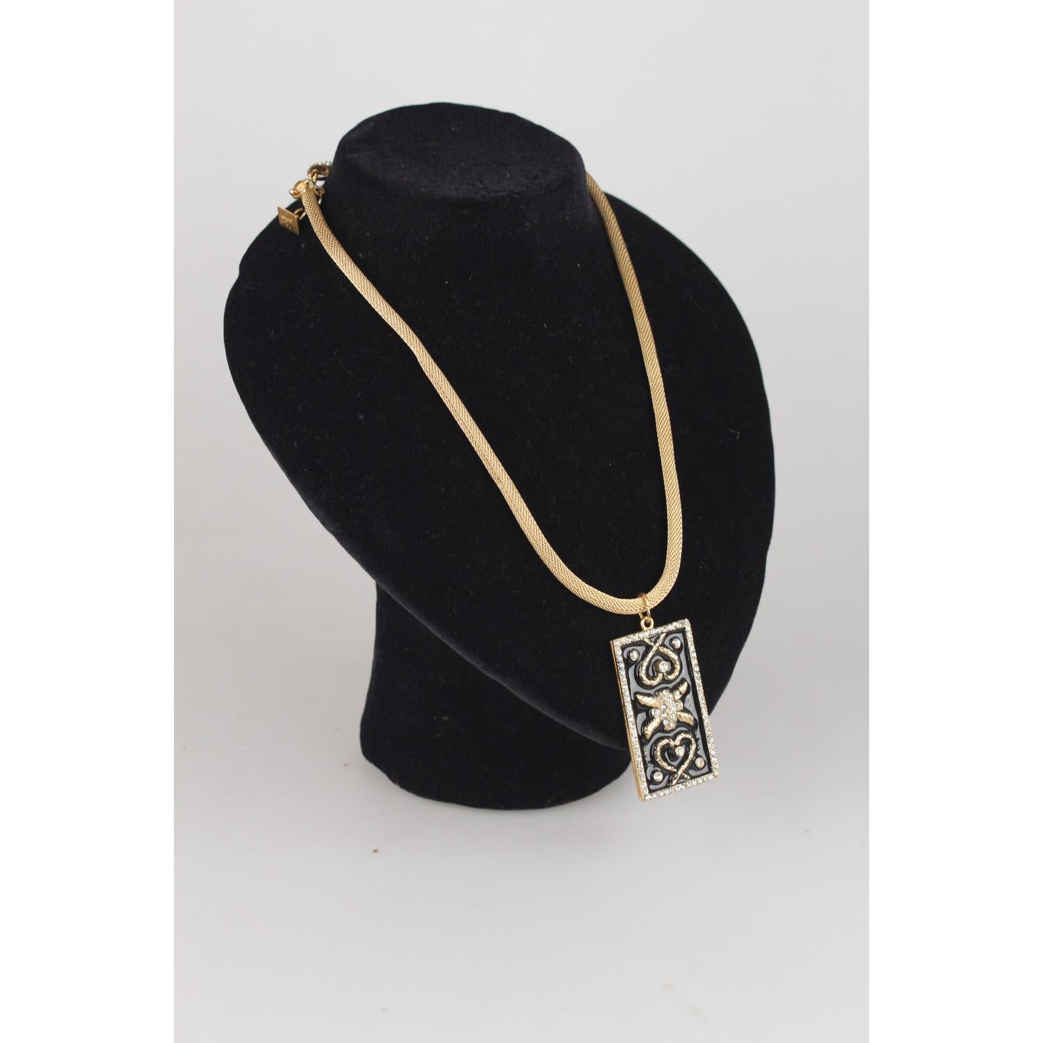 Haute Couture 1990s necklace with rectangular-shaped pendant created by Gianni De Liguoro.  Gold metal pendant decoarted with black enamel and small crystal rhinestones. Gold tone milanese mesh chain necklace with lobster closure (also the closure