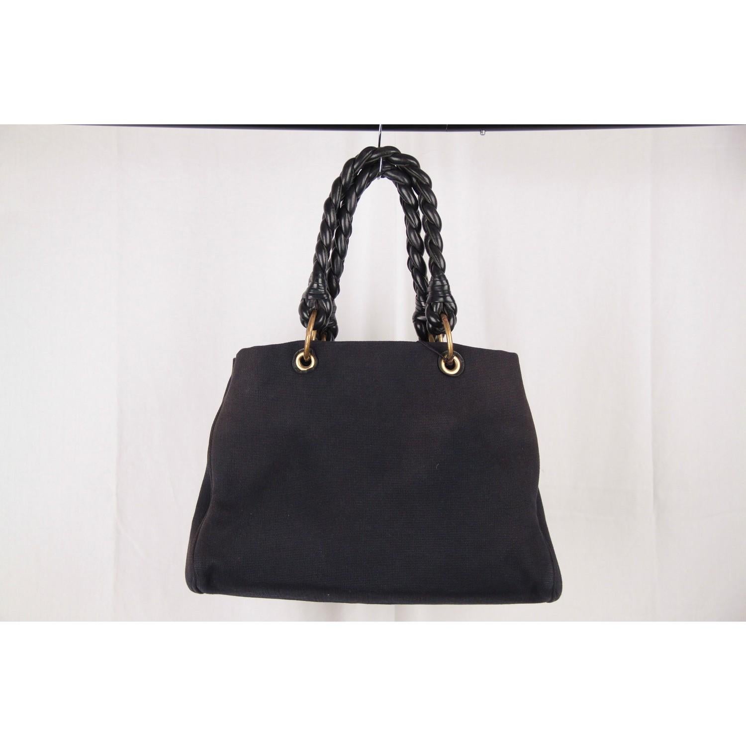 - Black canvas 'Sardegna' tote by BOTTEGA VENETA 
- From 2009 Cruise Colletion
- Thick braided leather handles
- Open top 
- Spacious interior 
- Can be further expanded by unsnapping either side 
- Includes Bottega Veneta dustbag
- 'Bottega Veneta