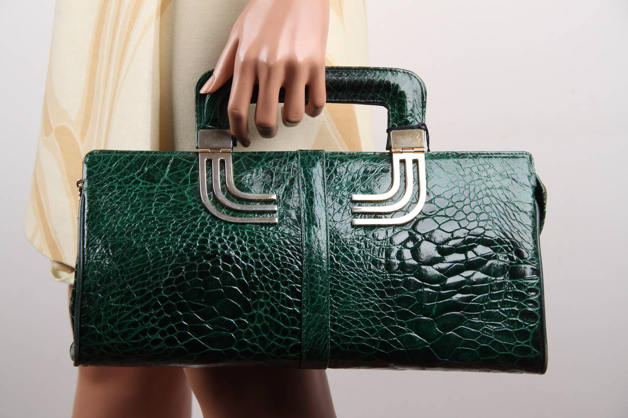 - Green turtle skin leather

- Beautiful color

- Gold metal hardware

- Upper zipper closure

- Green lining

- 1 side zip pocket & 2 side open pockets

- It will come with its matching wallet/coin purse

Condition rate & details