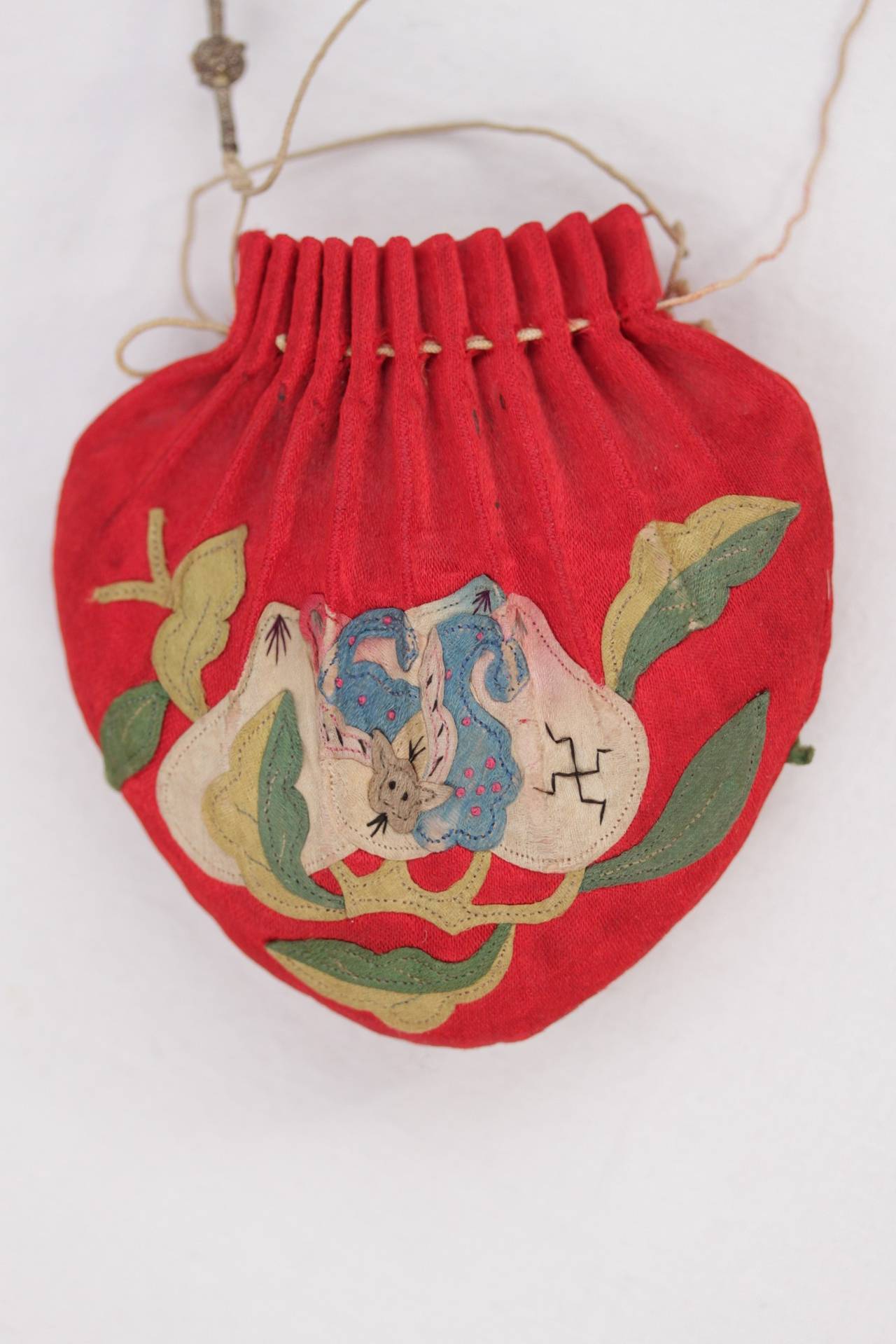 - Beautiful embroidered Chinese scent pouch. - From the late 19th century (Qing/Ch'ing Dinasty) - Red Silk with lovely embroidery on both sides - Silk tassel elements - These charming decorative pouches were used as a sachet pouch and are also