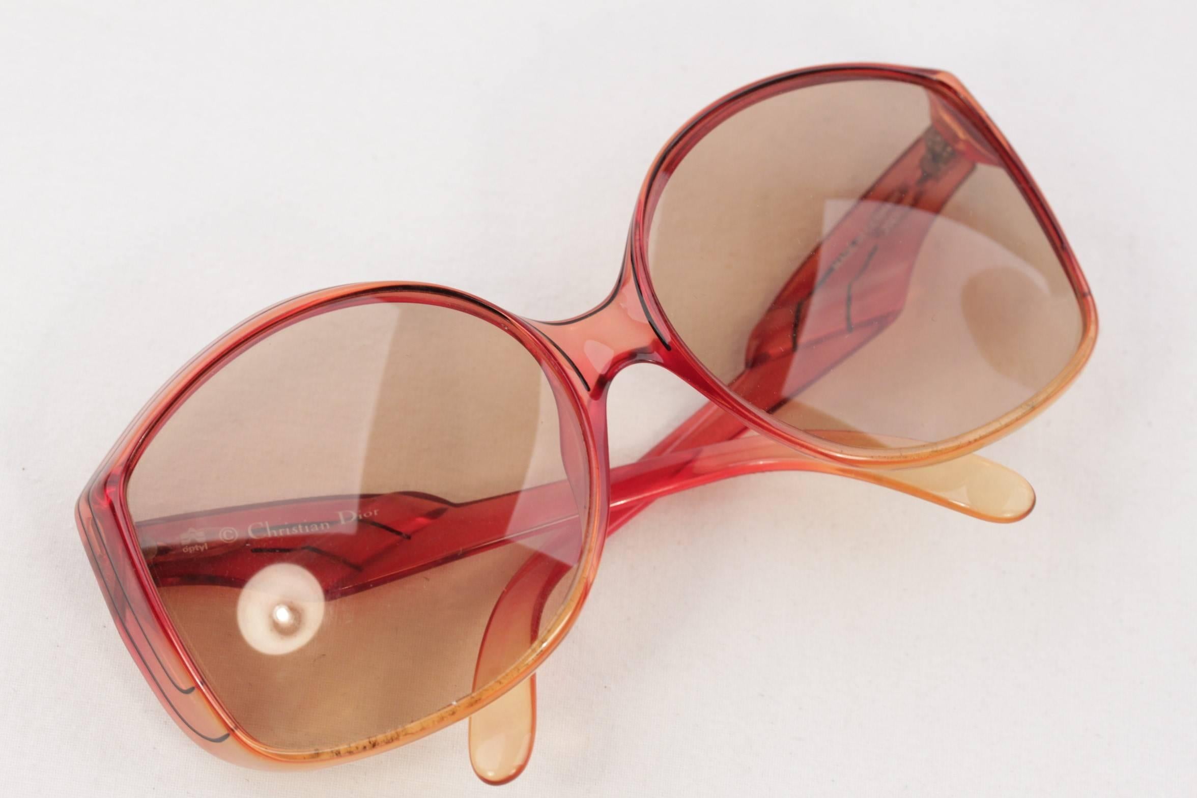 - Oversized and unique design by CHRISTIAN DIOR from 1980s
- Semi-transparent orange OPTYL frame
- Oversized design
- Brown lenses (NEW LENSES)

Condition rating:

GENTLY USED~ Previously used. Lens may have some micro scratches. Arms and