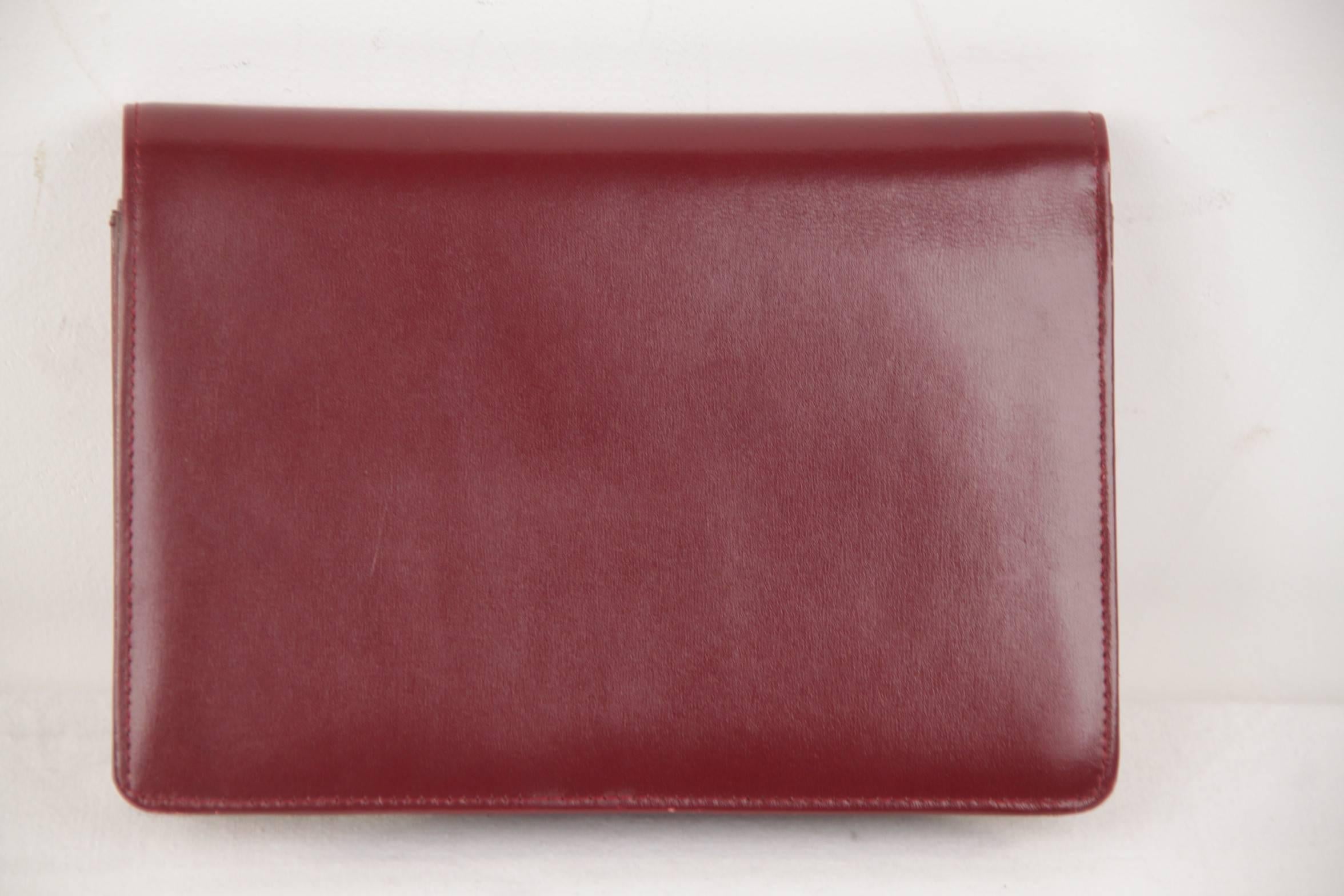 burgundy leather clutch bag