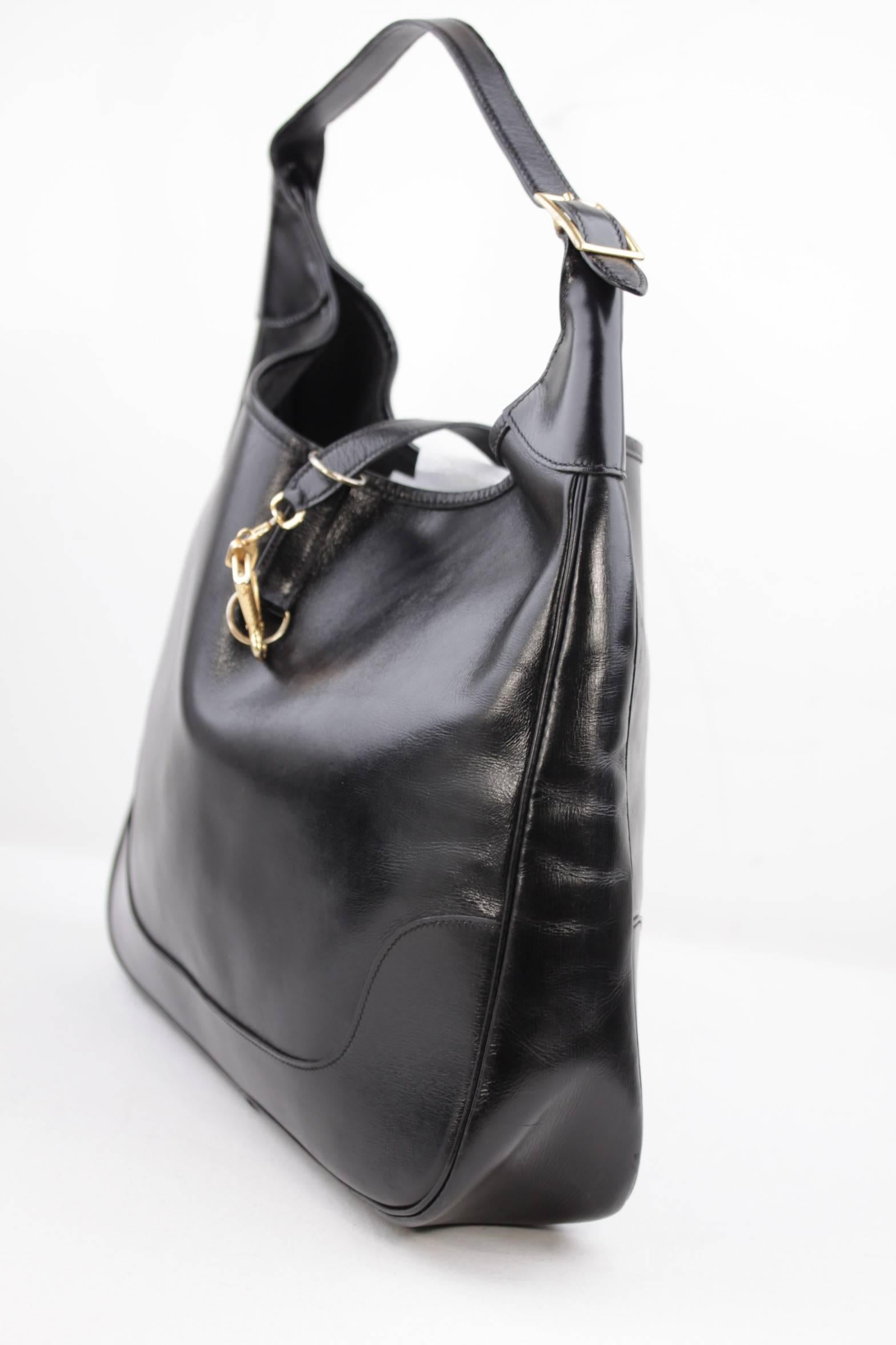 - Vintage HERMES Box Leather 'Trim' Hobo Bag in Noir Black
- This super-chic shoulder bag is crafted of polished soft box calfskin leather
- The bag features an extending looping shoulder strap with a gold buckle
- Fold over strap with a gold