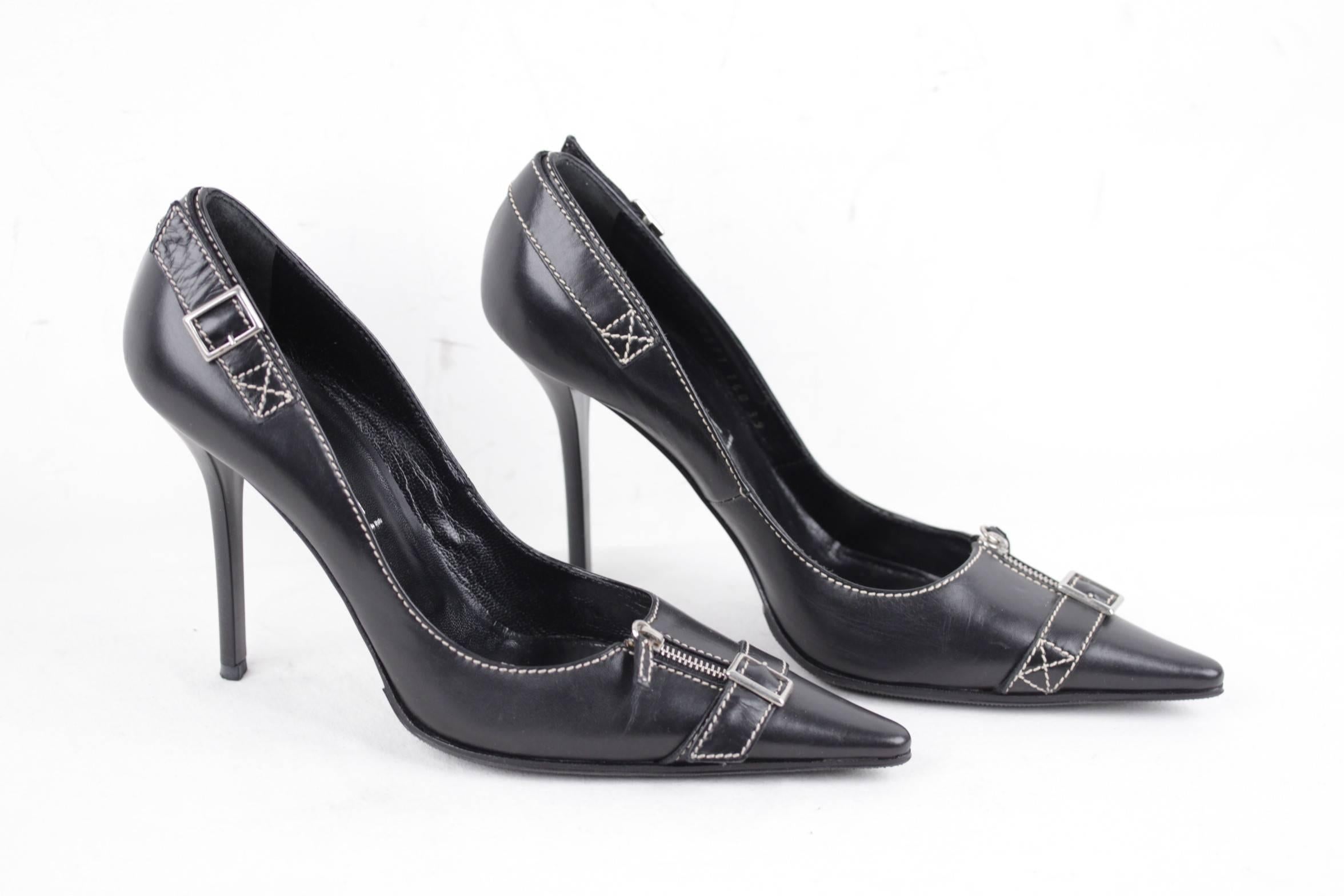
- Size:39
- Color Black
- Leather upper with contrast stitchings
- Stiletto heels
- Pointed toes
- Zip and buckle detailing
- 4 1/4 inches - 10,7 cm heels

Condition rate & details (please read our condition chart below): EXCELLENT