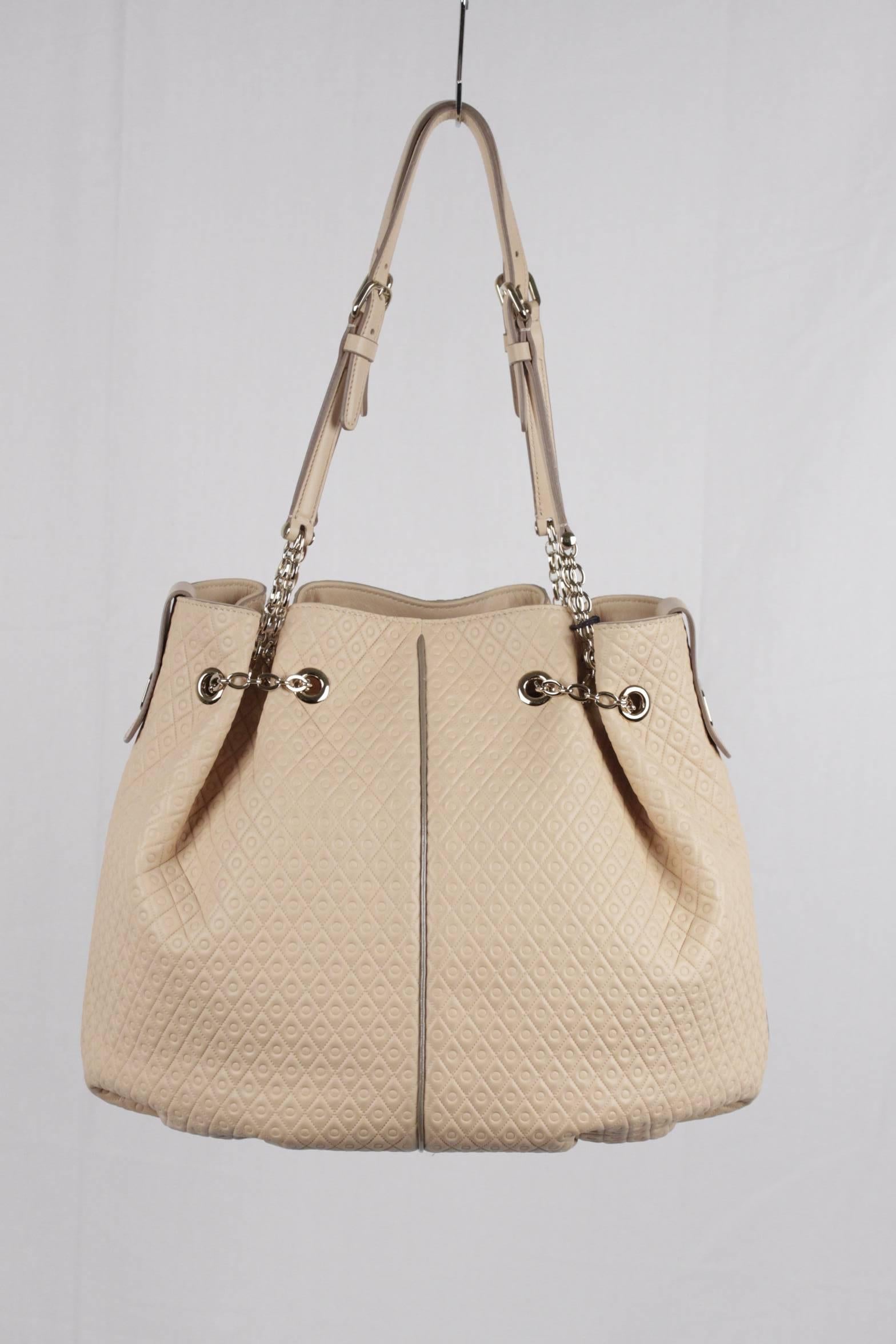  - TOD'S beige leather bucket shopper tote shoulder bag
- Hand stitching
- Embossed pattern
- Gold metal hardware
- 1 interior zip pocket
- Open top with engraved snap tab closure
- Dual straps
- Protective feet
- TOD'S name plate
- Reatil