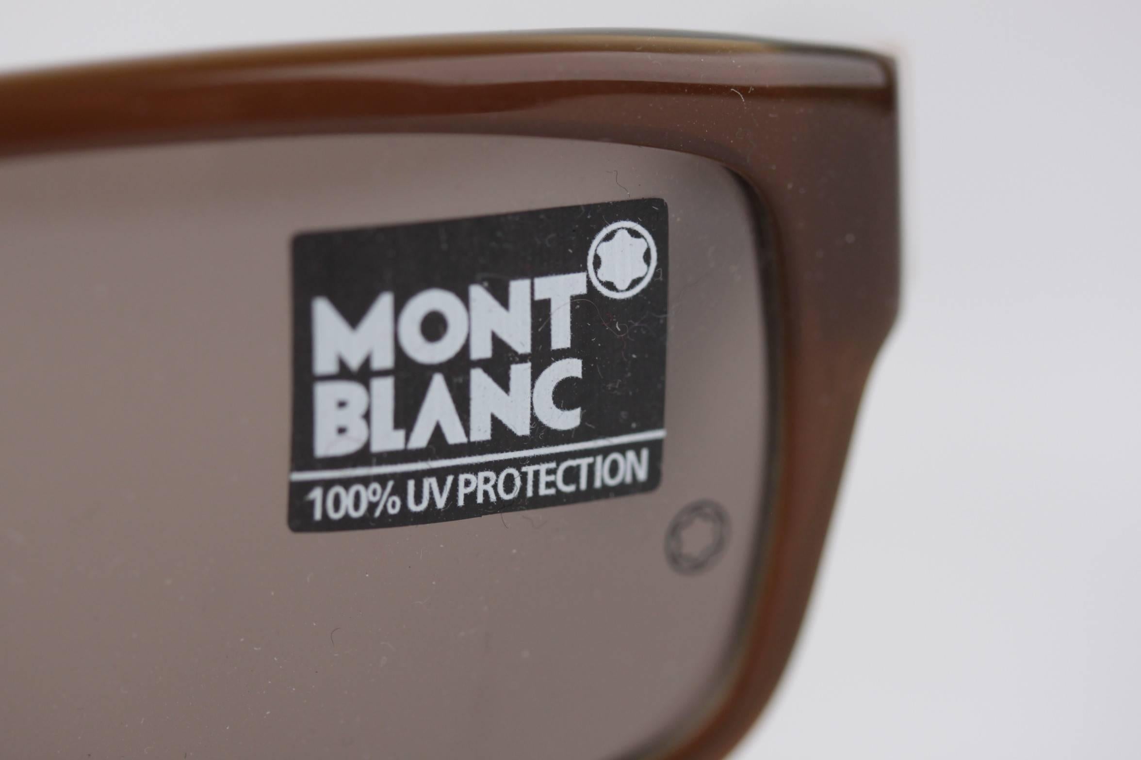 - rectangular-shaped sunglasses, signed MONTBLANC (Made in Italy)

- original lMONTBLANC lens (w/ MONTBLANC logo)

- 100% UV protection

- Brown color on the front / Military Green color internally

- Gold metal accents

- MONTBLANC signatures on