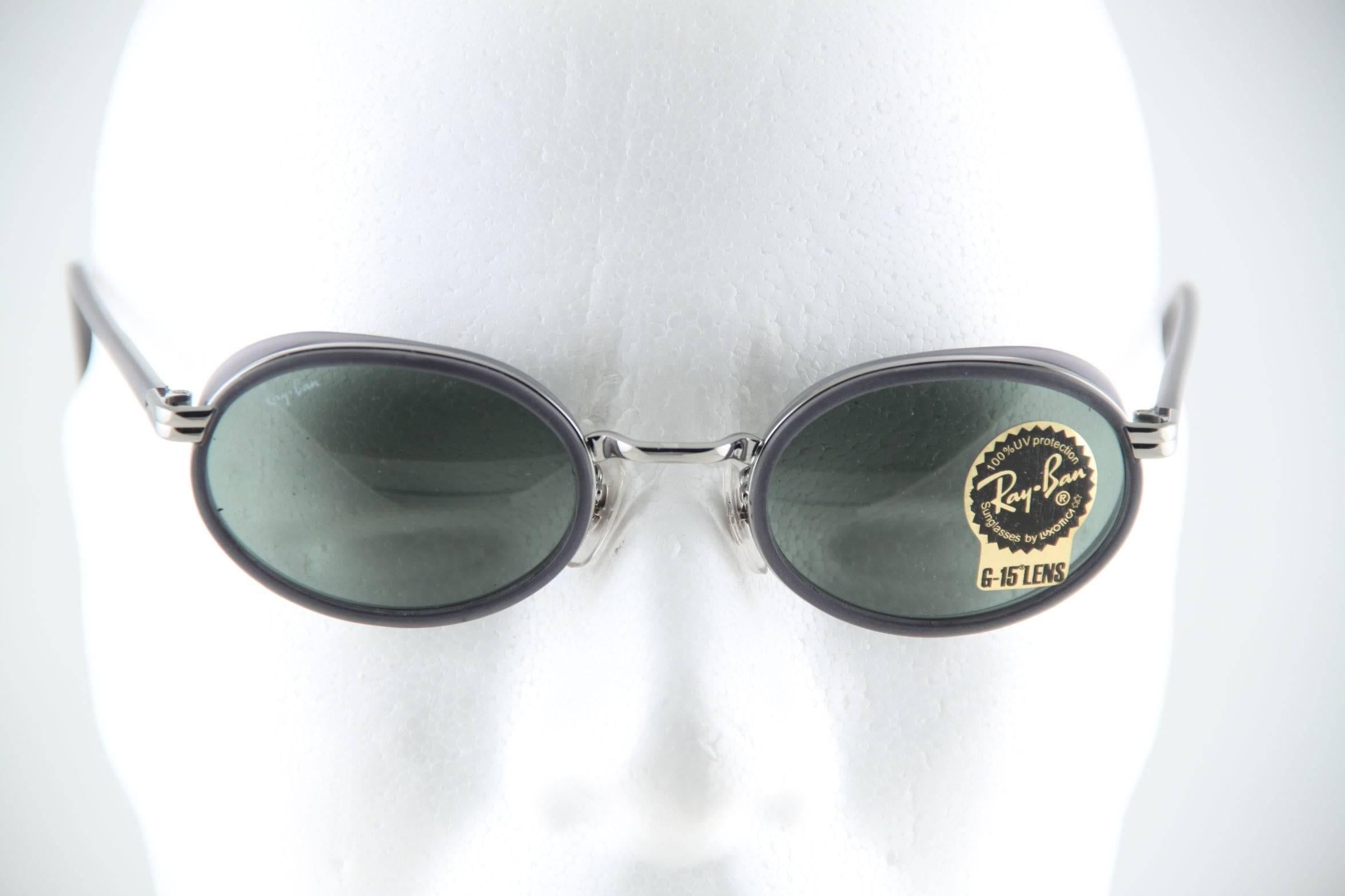 - Ray-Ban by Bausch & Lomb

- Mod. RB3037 - W2813 (1990s stock), Gray VINTAGE beautiful OVAL sunglasses, with Ray-Ban Bausch & Lomb original G15 lens.

 Condition: MINT SUNGLASSES. They will come with an unbranded case & cleaning