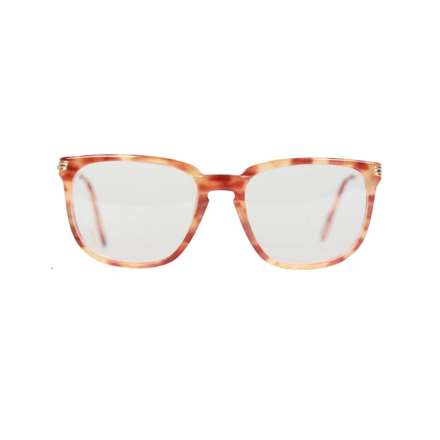 - Precious Cartier glasses of the 90s, rimmed eyeglass
- Light tortoise and gold metal frame
- Model: LUMEN - Ref numbers: 1760086
- Expressive design & discreet frame coloring
- Original Cartier clear demo lenses (with embossed logo on right