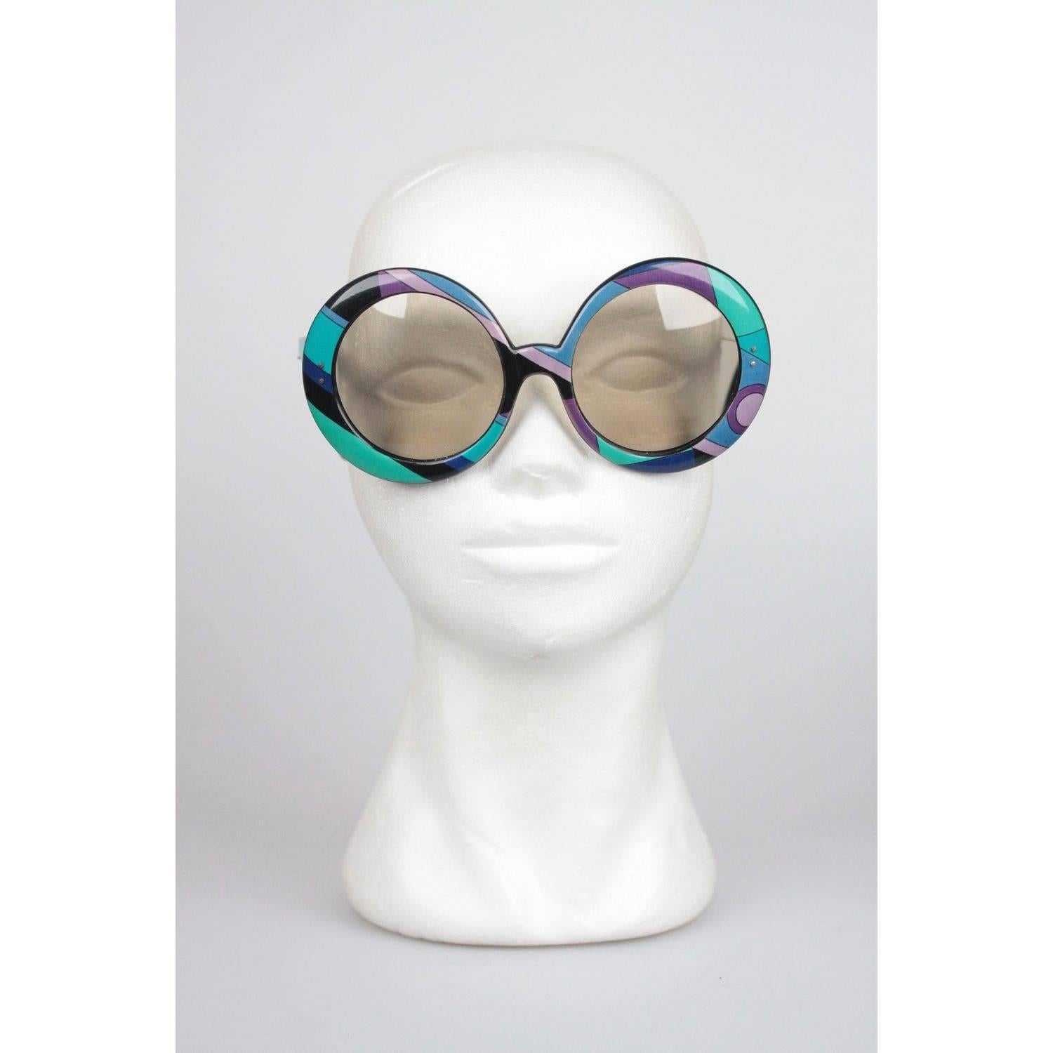 Fashion Statement Iconic EMILIO PUCCI Sunglasses,  Made in France
- Oversized frame from early 70s
- Mod style, large round shaped frame with light brown lens
- Fantastic Classic Pucci Graphics in blue and green shades
Measurements:
- TEMPLE MAX.