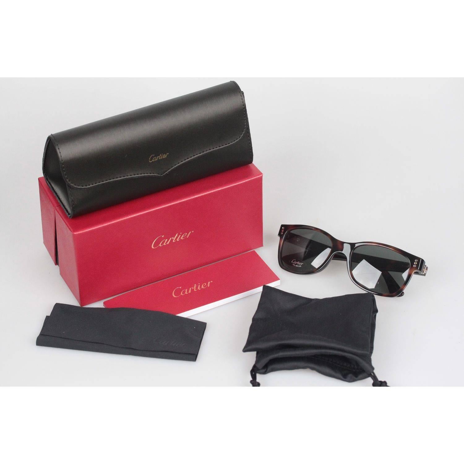 Classic and Elegant Rectangular Sunglasses by Cartier
Brown, tortoise look frame
Hand Made in France
White Gold Finish

Measurements:
- TEMPLE MAX. LENGTH: 135 mm
- TEMPLE TO TEMPLE - MAX WIDTH: 135 mm
- EYE / LENS MAX. WIDTH: 54 mm
- EYE / LENS