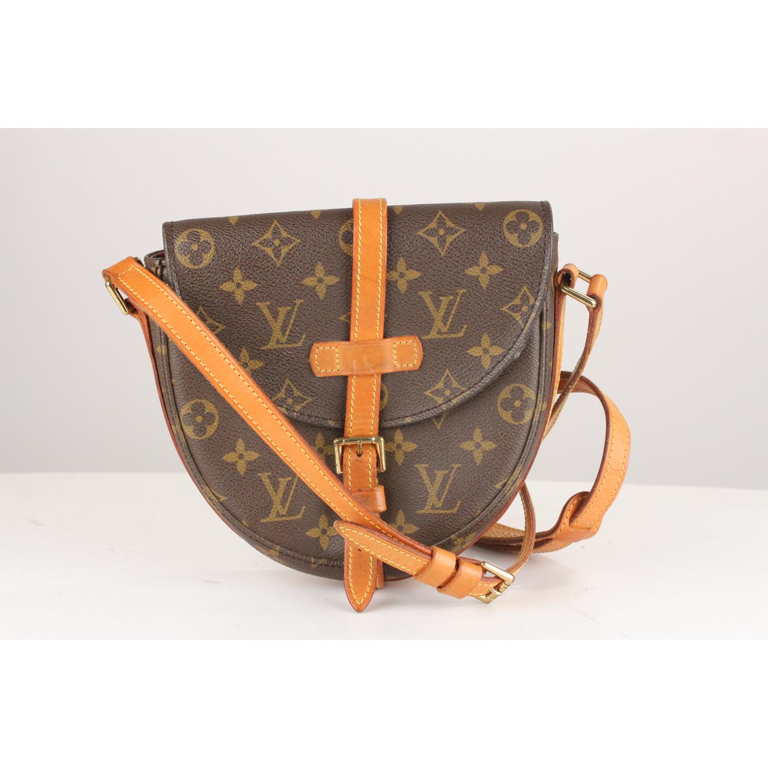 Brown monogram canvas 'Chantilly'crossbody bag from Louis Vuitton. Featuring a rounded shape and has a versatile adjustable shoulder strap that can be worn on the shoulder or cross-body for hands-free convenience. Foldover top, a buckle fastening