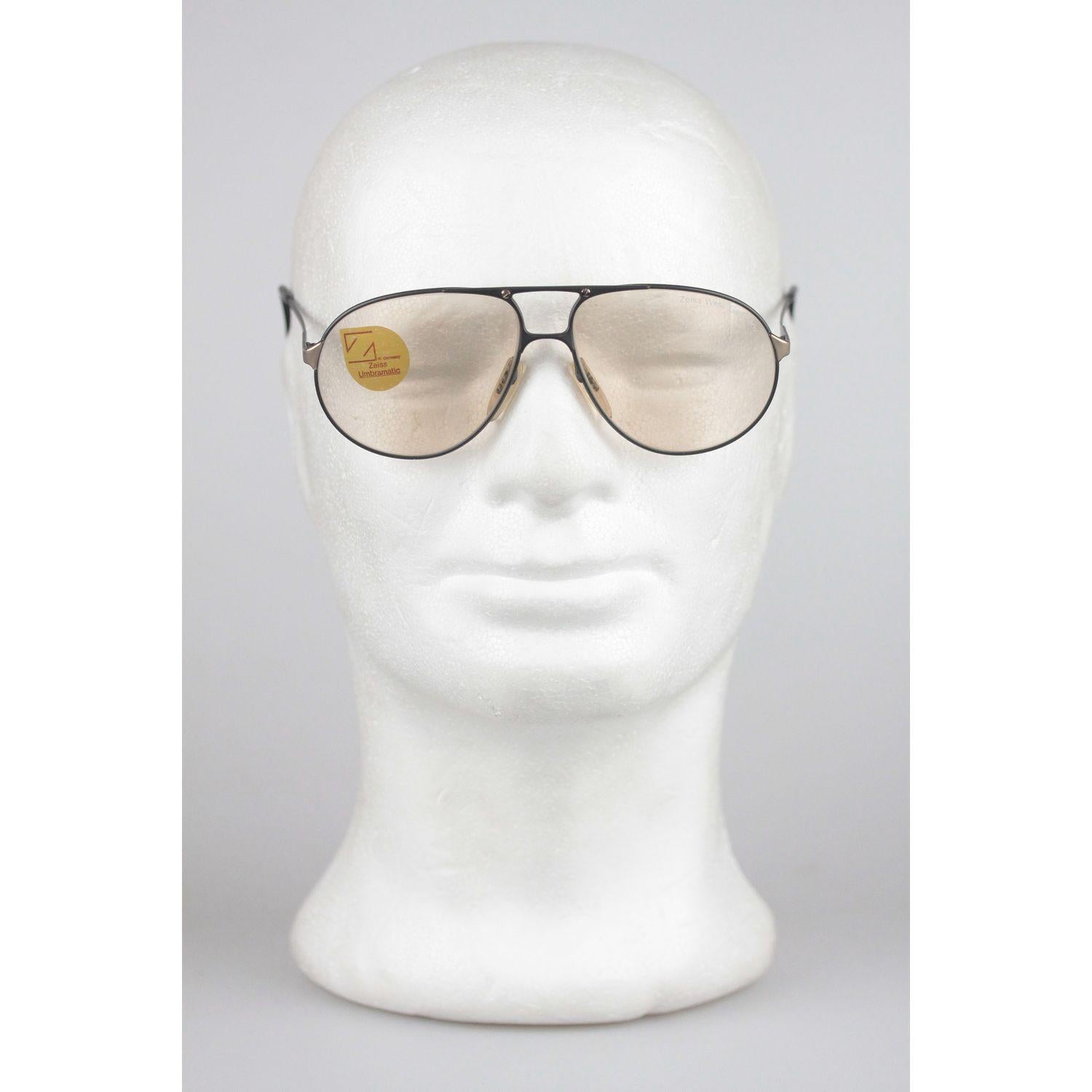 - Gray metal sunglasses by Zeiss from the early 80s
- Made in West Germany
- Original 'Umbramatic lenses' darken automatically in the sun
- 100% UV lens
- Aviator-design from West Germany
- Lightweight & very pleasant to wear 
- Style & Mod.: 9289 -