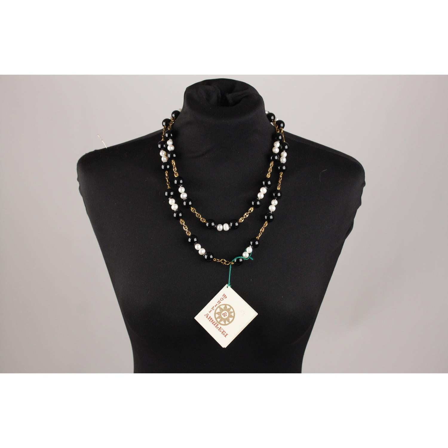 MATERIAL: Onix beads, Baroque Pearls, Silver

COLOR: Black, White

COUNTRY OF MANUFACTURE: Italy

Condition
CONDITION DETAILS:

A+ :MINT CONDITION! Mint item. Never worn or used