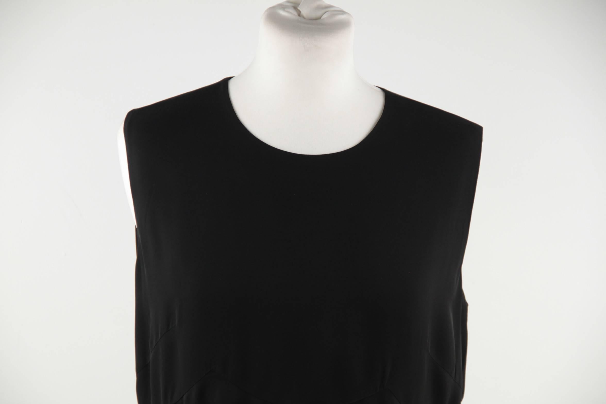 - Black 100% Viscose fabric

- Sleeveless styling

- Round neckline

- Rear zip closure

- Pleated hem
- Size: 44 IT (The size shown for this item is the size indicated by the designer on the label) It should correspond to a MEDIUM