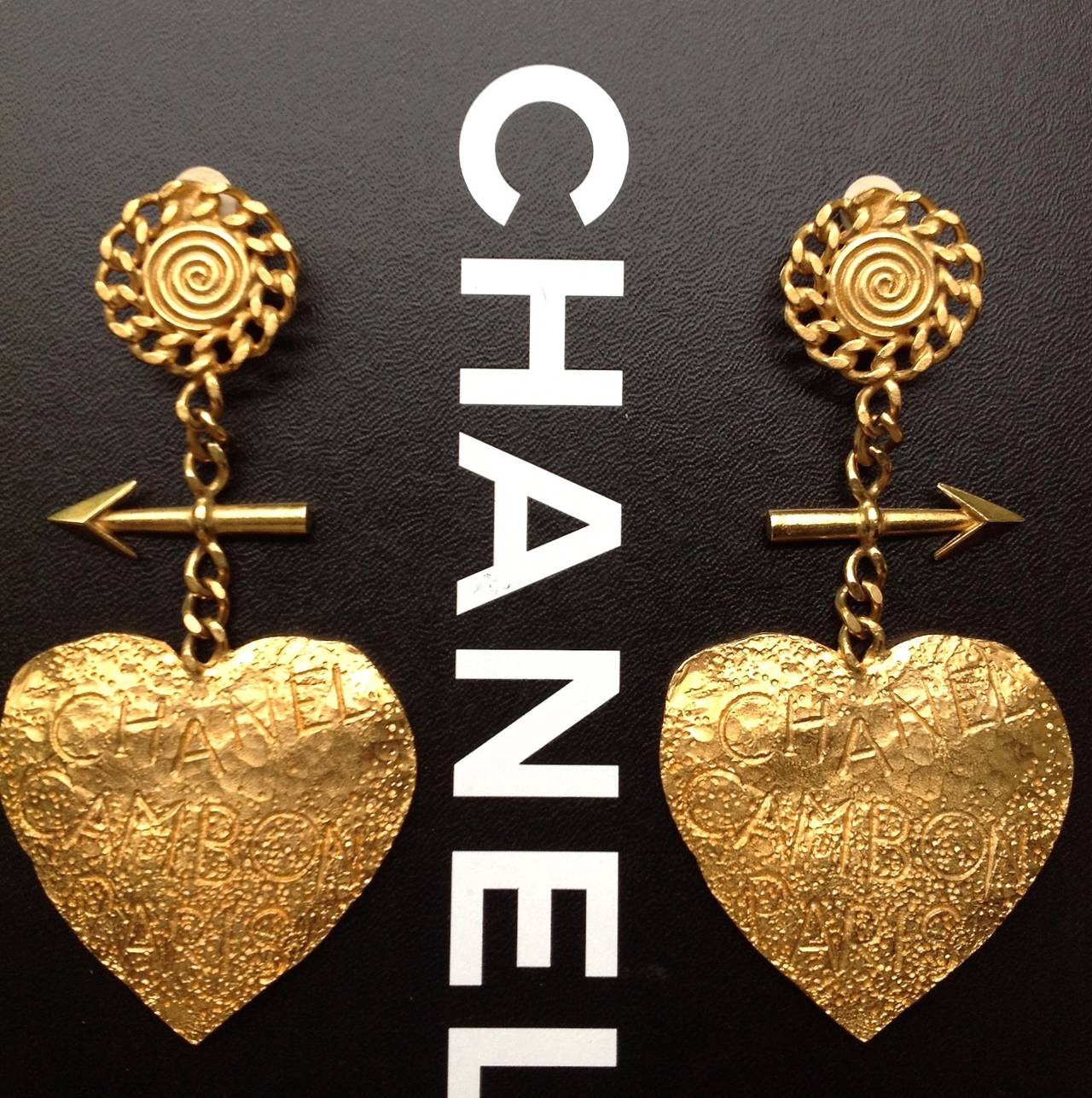 These oversize earrings are super rare and are in the  most  complete and exquisite ones from Chanel  93P arrow heart collection.  
Fully handmade with rich hammering works and fun graffiti on pure gold like gold plating.  
Very precious