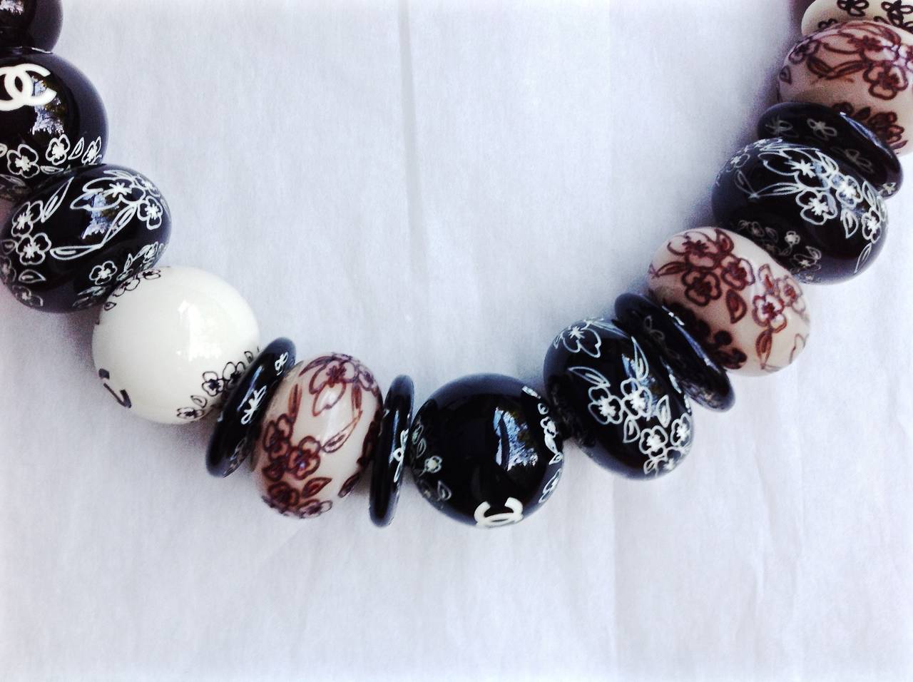 THIS NEW NEVER WORN beautiful jumbo beads extra long necklace is from Chanel 2006 cruise collection. 
Handmade with Rich oriental ethnic beautiful elegant hand carving flowers on resin beads. 
 Among those jumbo beads, some brighter coloured beads