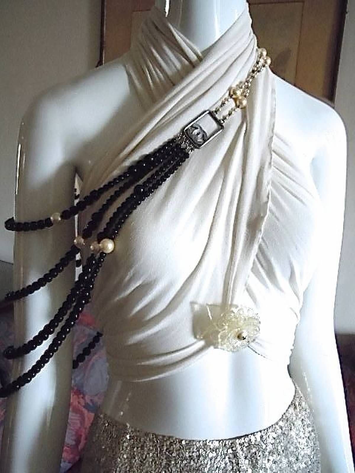 THIS signed massive and substantial with four graduating strands rare piece is done with very high quality luscious gold colored glaze glass pearls and glass black beads that vary in size ( 6mm- 14mm ).

***  Designed to be worn in 2 ways (  photo