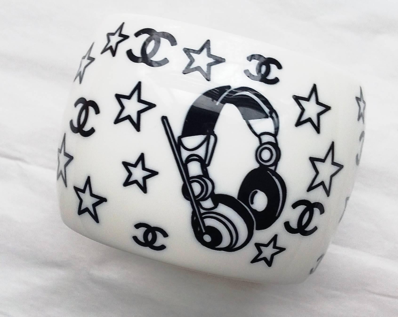 CHANEL ✿*ﾟFAMOUS Music Cassette Headphone series resin  bracelet. This 2004P POP chic fun and rare piece is done by resin cuff with fun drawing,  is still kept in mint condition including metal ware. ultra little signs of worn, and the metalware is