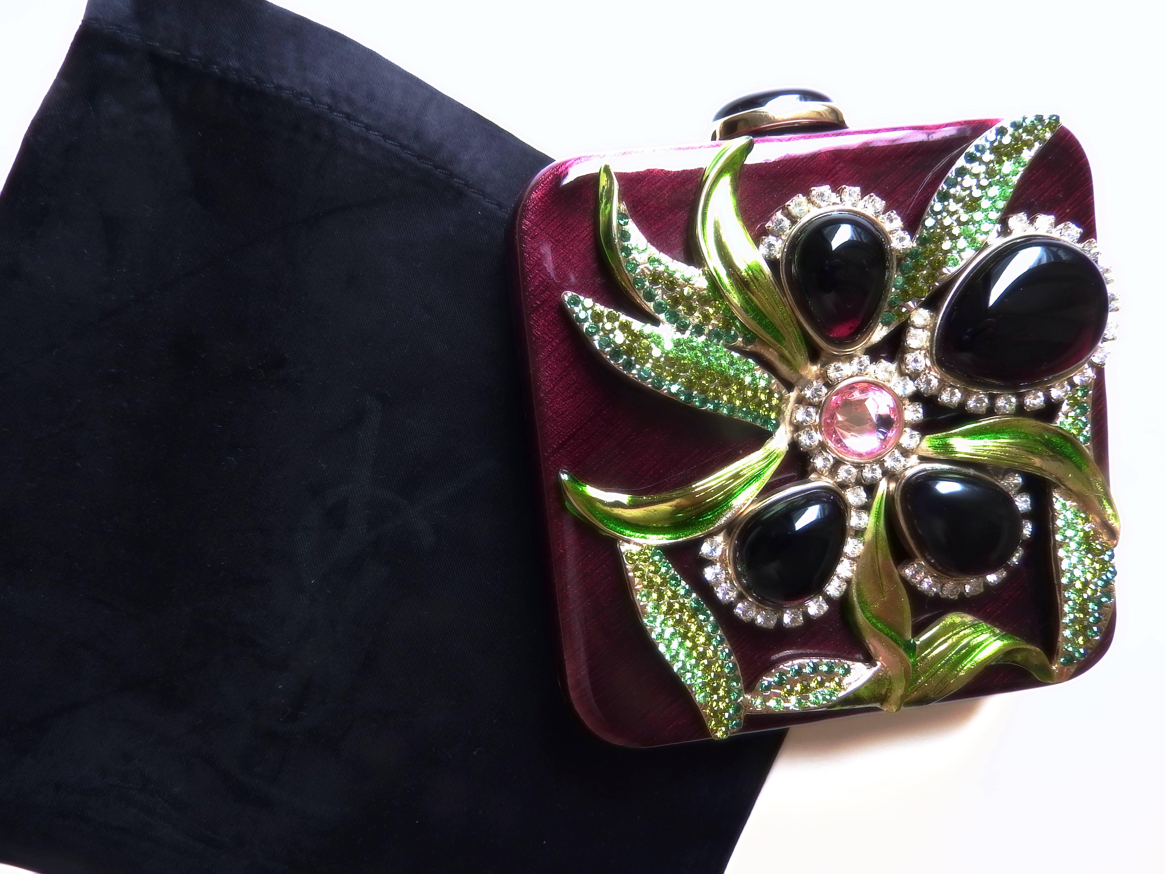 This artisan piece is from 2004 Spring Summer Yves Saint Laurent by Tom Ford .
and is one of the most lavish jewelry piece by Tom Ford.  
features all the most expensive details, such as full perfect works on top of a heavy solid metal case with