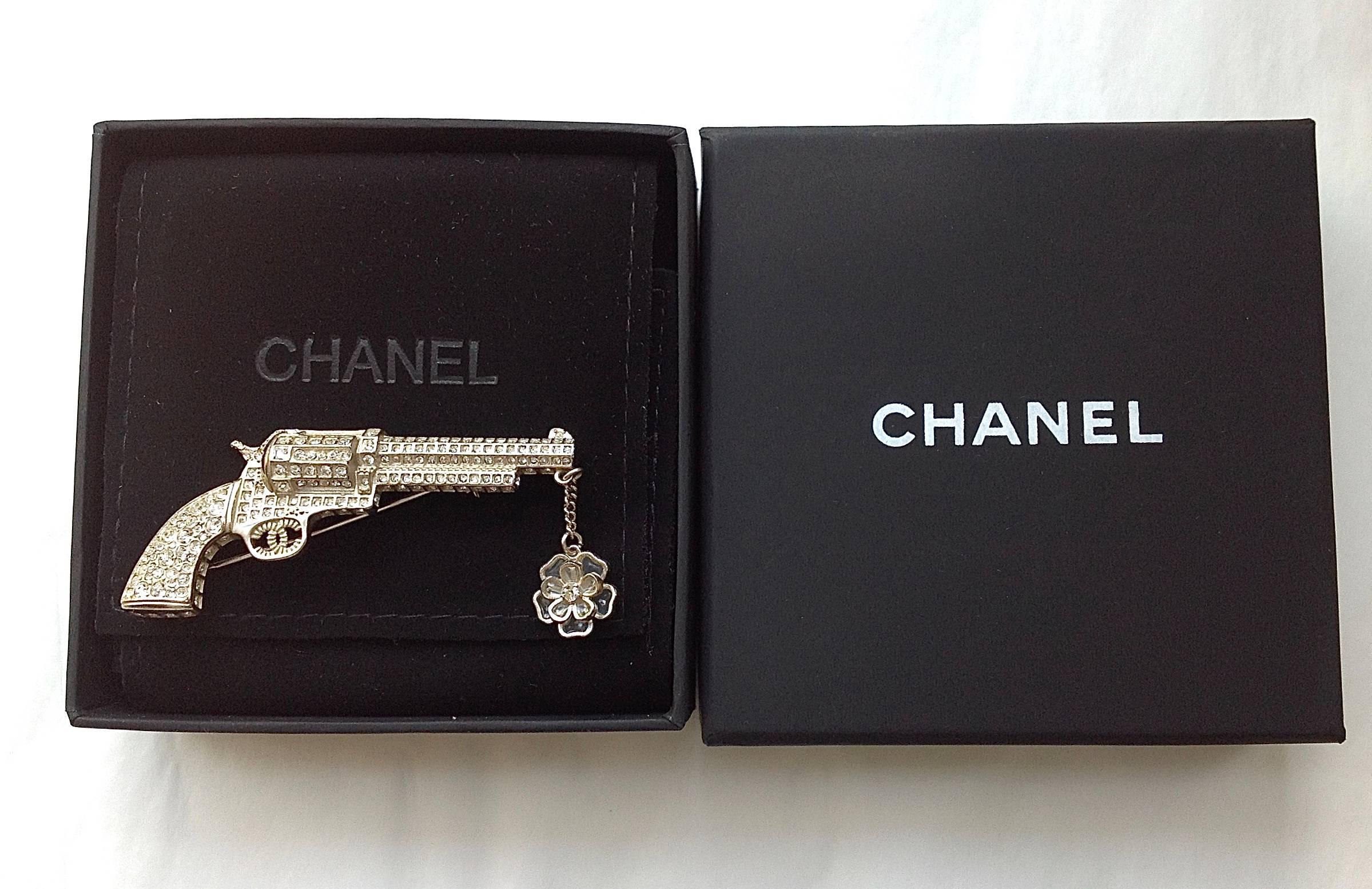 A collector's piece from Chanel Fall/Winter 2014-2015 Paris -Dallas collection. All the details from every angles showing this ultimate craftsmanship to make this brooch just like a real pistol with sweetness. 
Fully adorn with baguette crystals