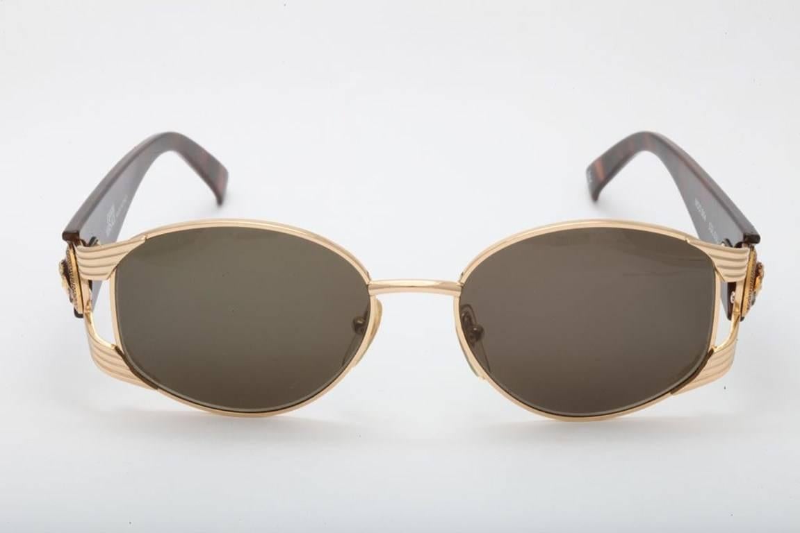 Vintage Gianni Versace MOD S64 COL 030 sunglasses.
This exact pair was worn by Rihanna in her video “Pour It Up”.
