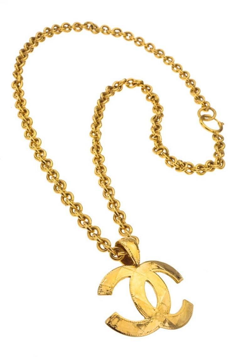 Chanel CC necklace with quilted details. CC charm 1.6 by 2.2 inches, chain length 30 inches.