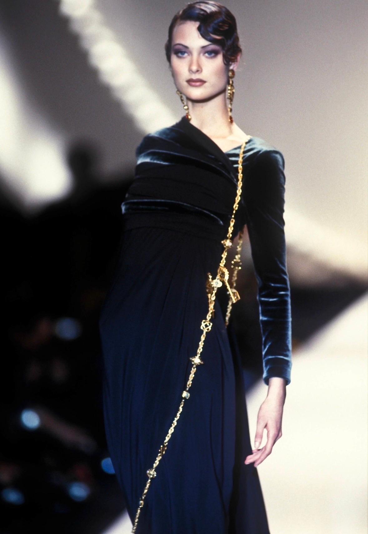 TheRealList presents: a gorgeous grey velvet Christian Dior gown, designed by Gianfranco Ferré. From the Fall/Winter 1993 collection, a version of this floor-length dress debuted on the season's runway, modeled by Shalom Harlow. This stylish gown