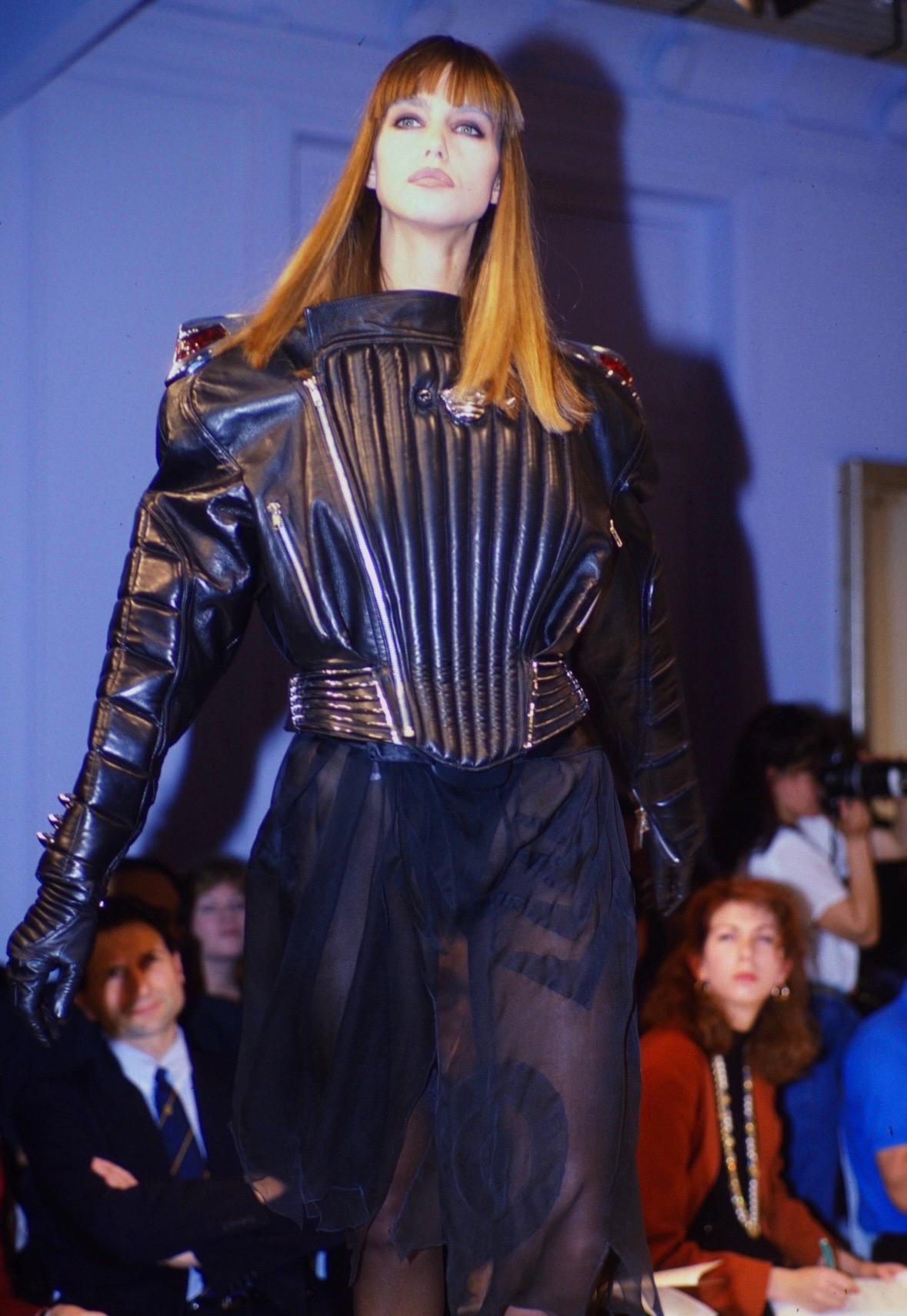 Presenting a major black leather Thierry Mugler biker motorcycle style jacket, designed by Manfred Mugler. From his Fall/Winter 1989 'Hiver Buick' collection, versions of this vintage eye-catching jacket debuted on the season's runway, on Roberta