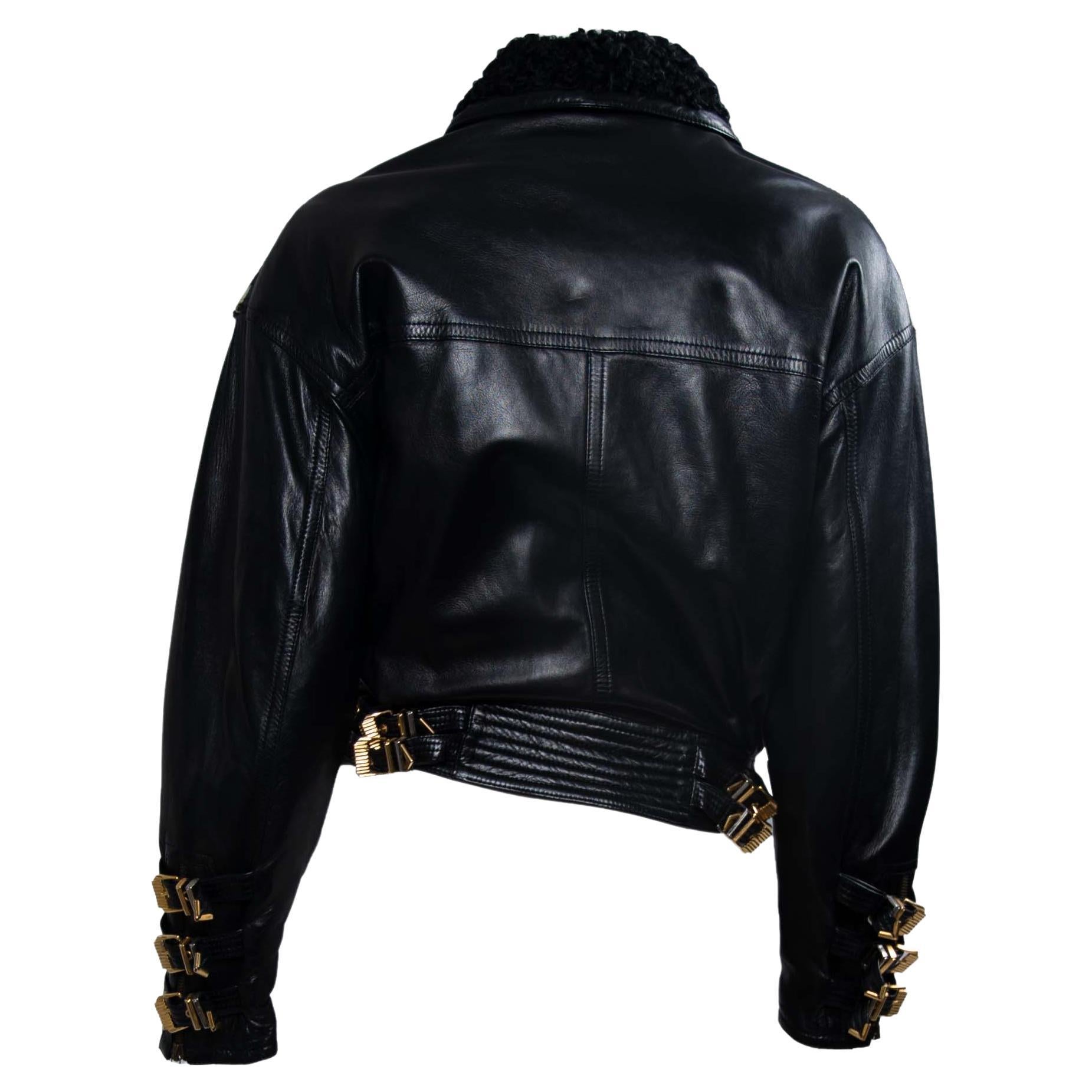 Presenting a Miss S&M (Bondage) spotted calf hair leather buckled jacket designed by Gianni Versace. This piece was created for the F/W 1992 collection and features the collection's iconic bondage-inspired buckles throughout. The jacket is primarily