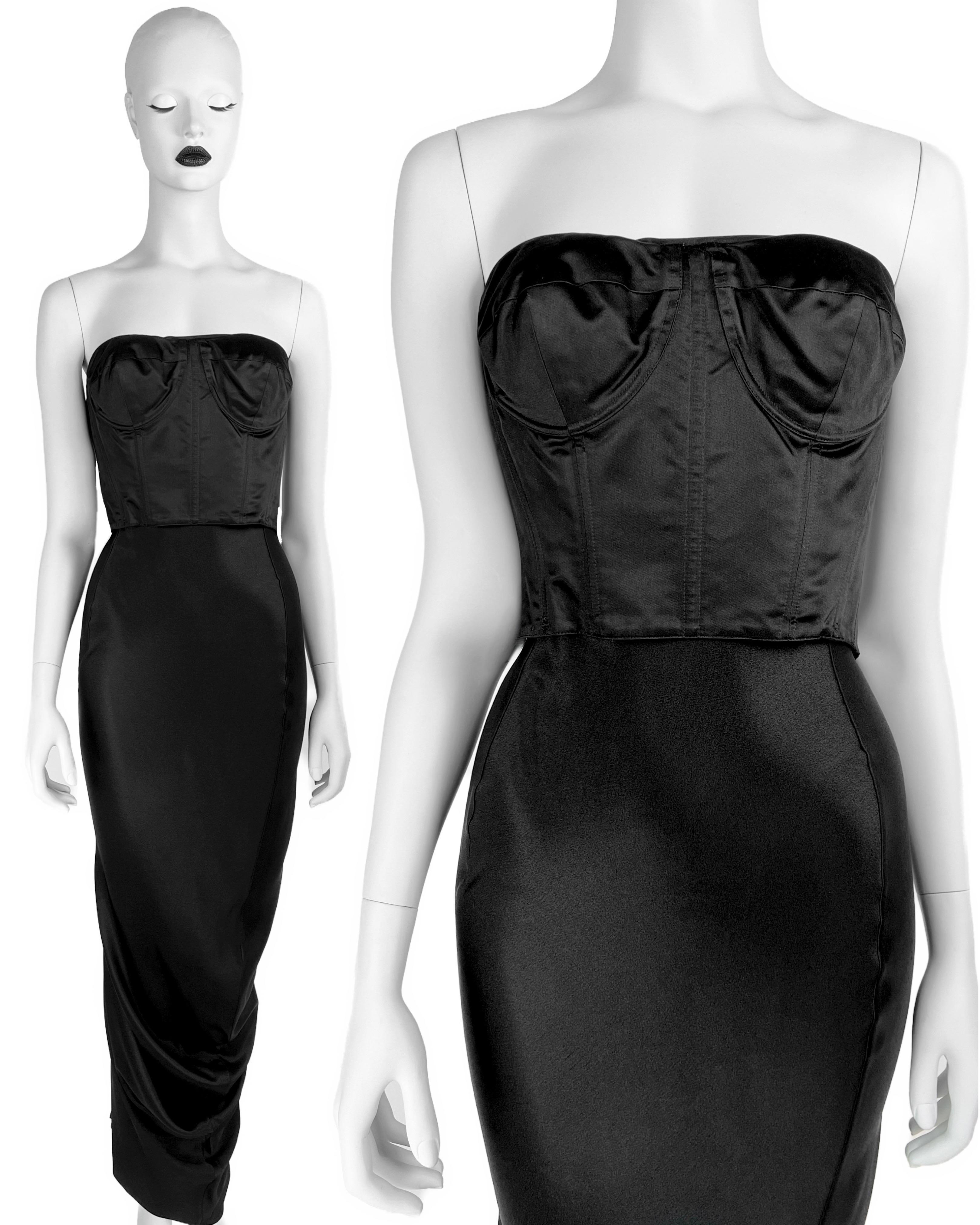 As seen in another fabric on the runway, this stunning sample of John Galliano Fall 1995 Corseted Gown in fabulous black! This dress can be worn TWO WAYS: with a corset facing outwards and inwards. Same style but in blue and short version was seen
