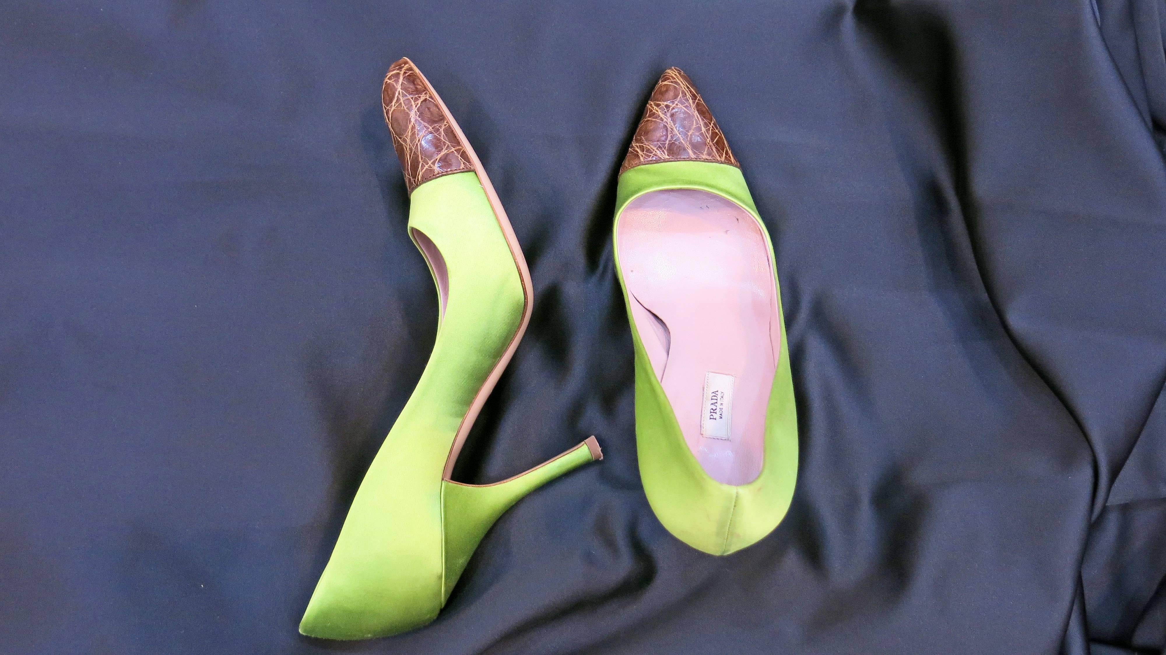 Unique pistachio green satin pumps by Prada with alligator leather toes. Leather soles. Heel is 4". A fun and out-of-the-ordinary shoe that is still reasonable enough for the workplace. A fun pop of color and texture for the drabness of the