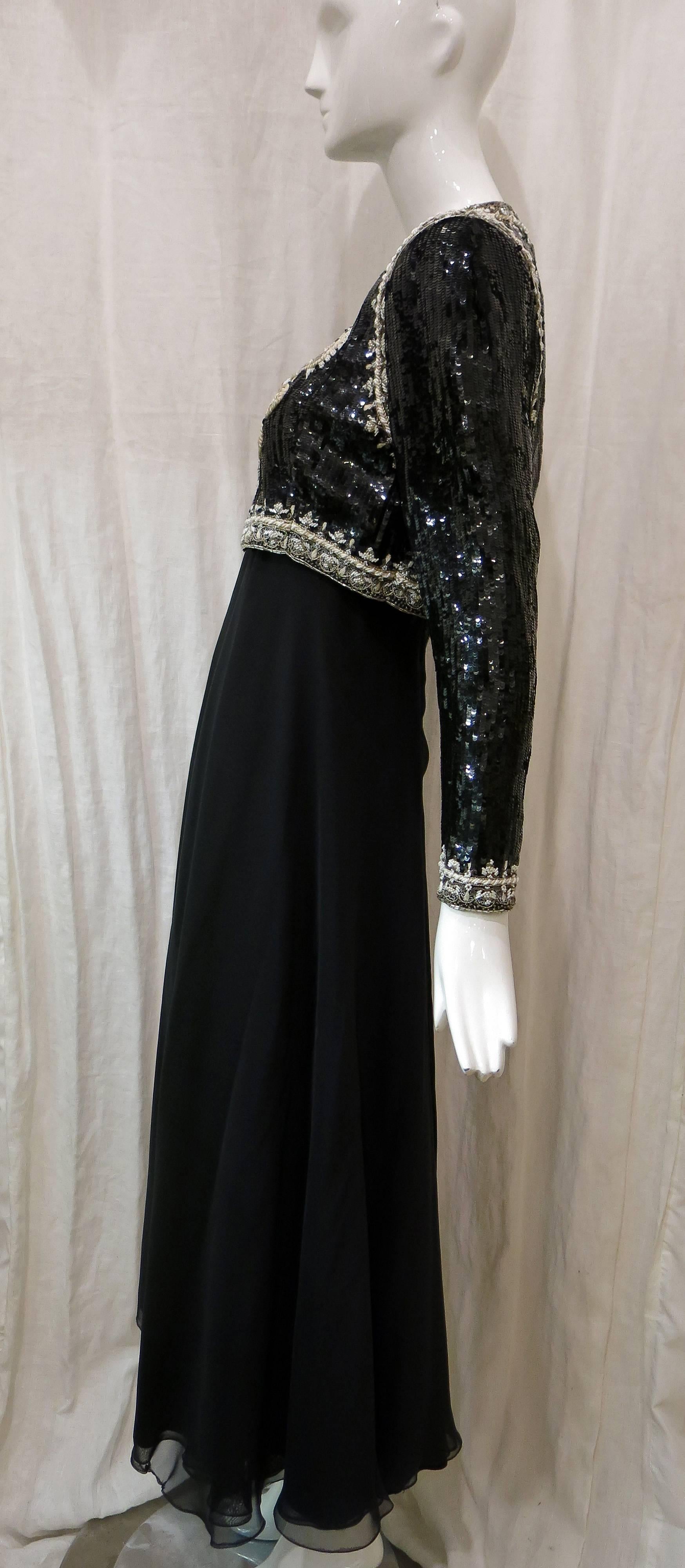 Cropped sequin jacket hits right at wrists. Single hook and eye closure at neckline. Black silver and white beading. Paisley design at front. Dress has spaghetti straps and sequin bodice in the style of the jacket. Asymmetric hi-low hem. Front hits