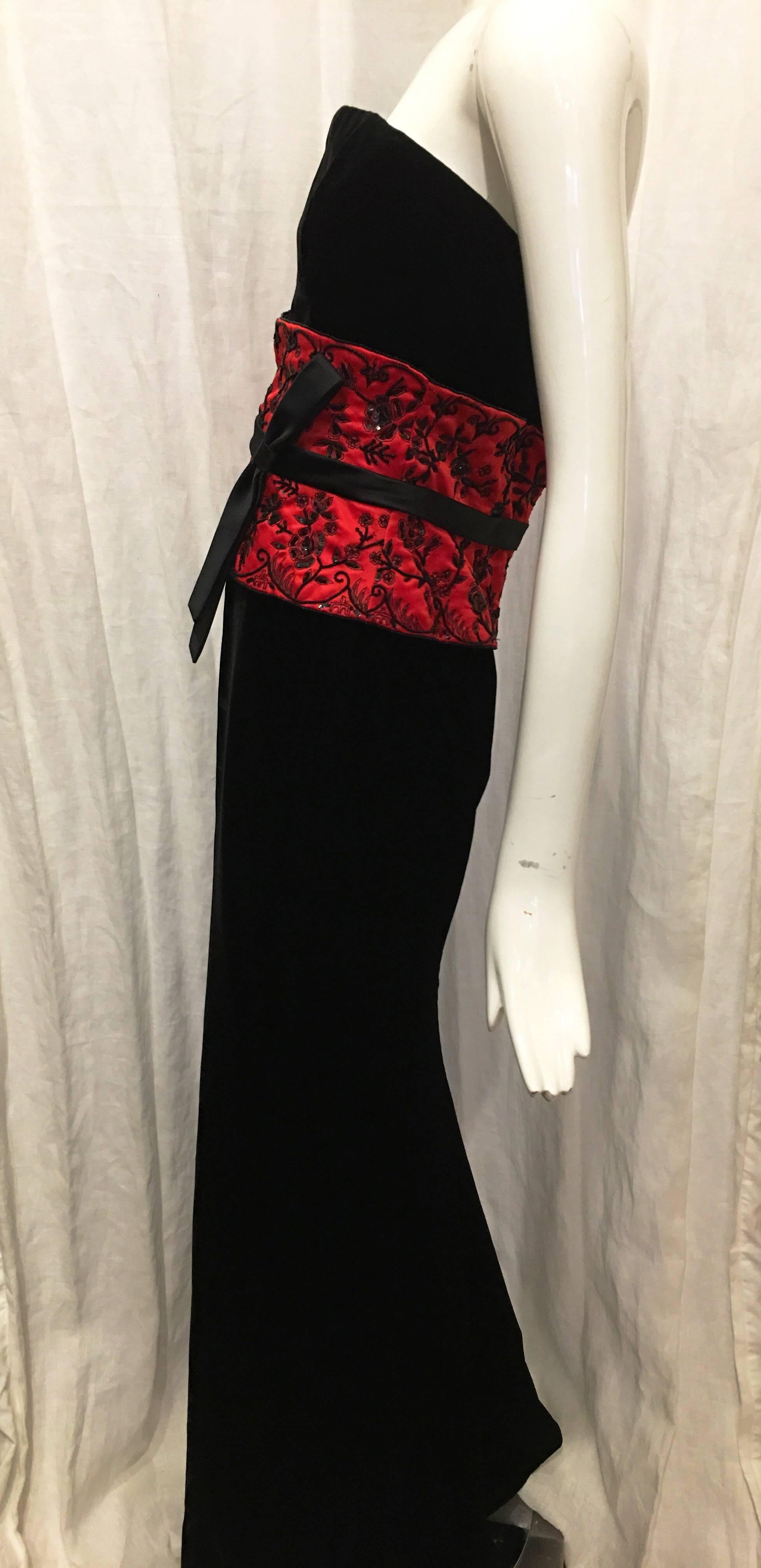 Black strapless velvet gown with red silk embroidered and beaded 