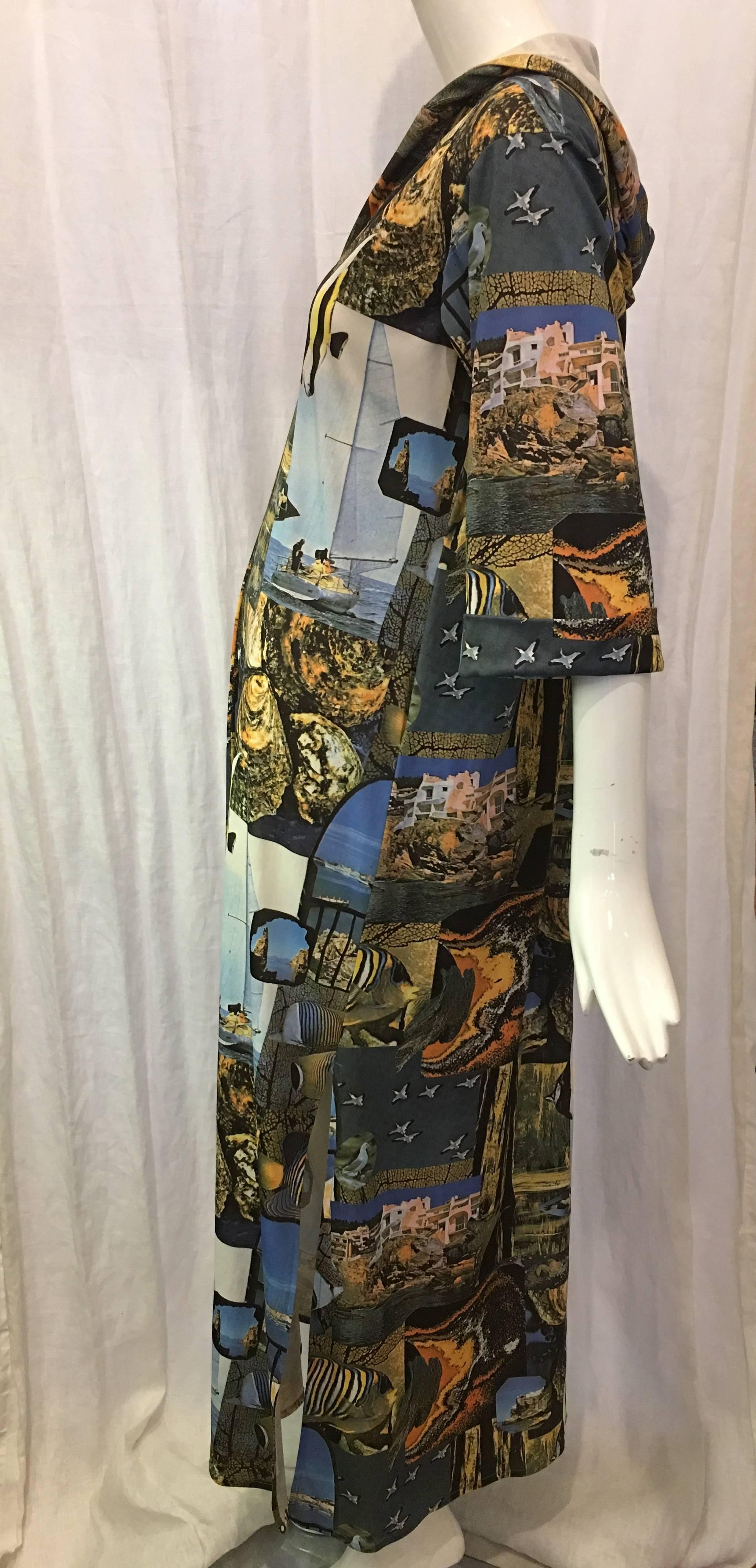 Full length hooded caftan with all over photograph print of aquatic scenes and wildlife. Collarless with 20